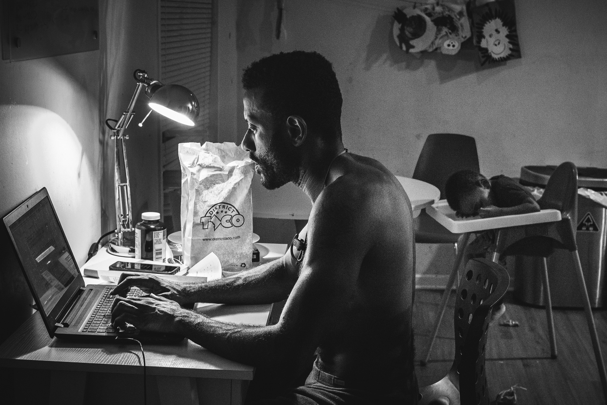 man working late at desk - Documentary Family Photography