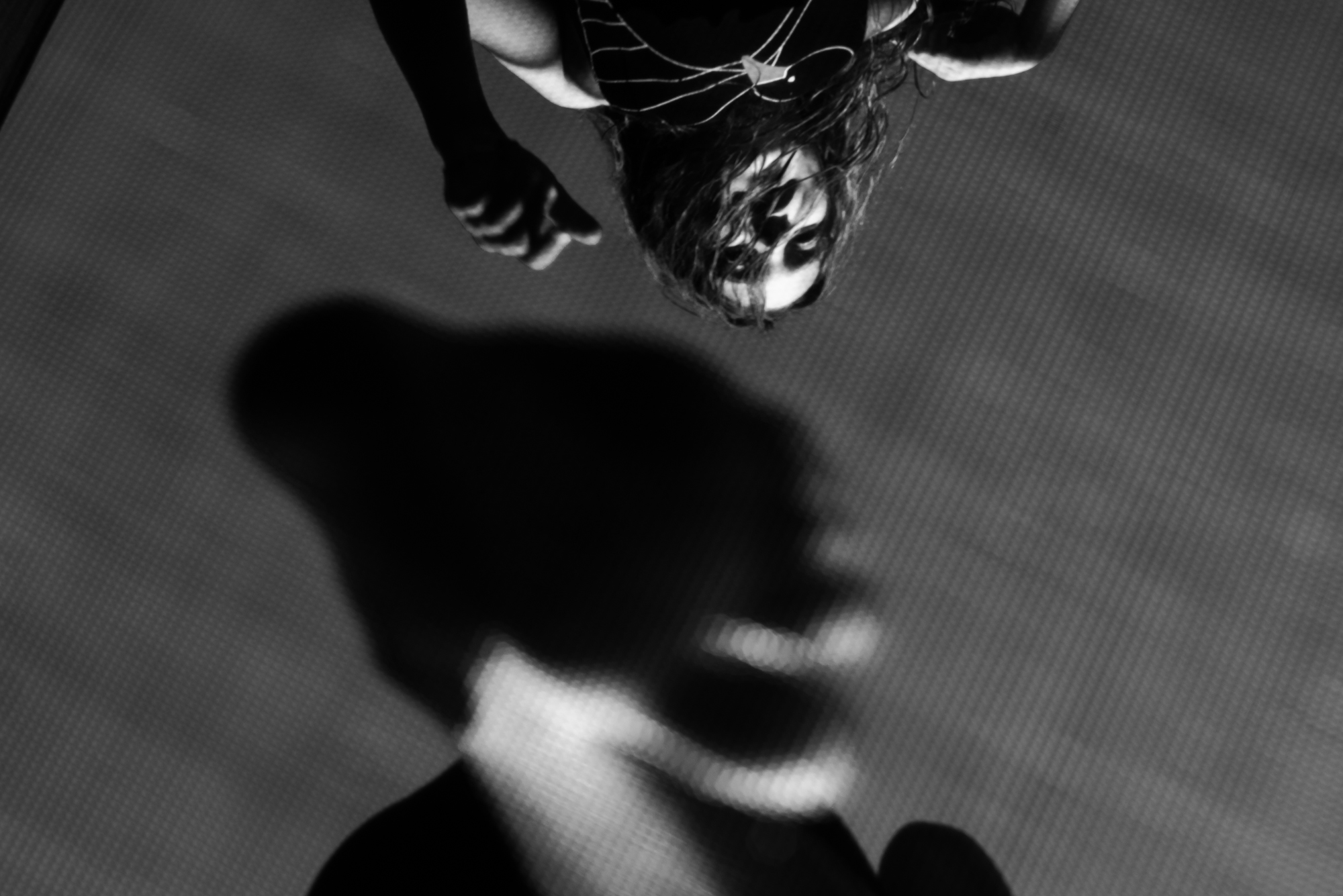 girl on trampoline from below - Documentary Family Photography