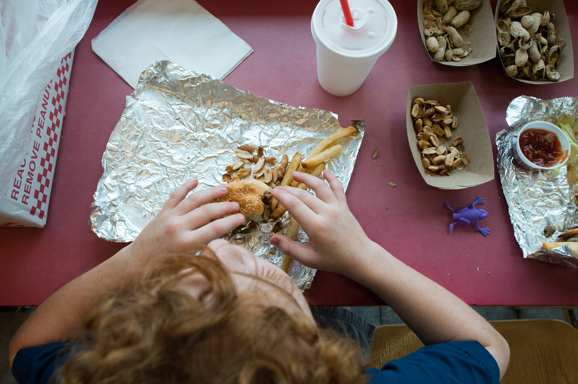 boy eats fast food - Documentary Family Photography