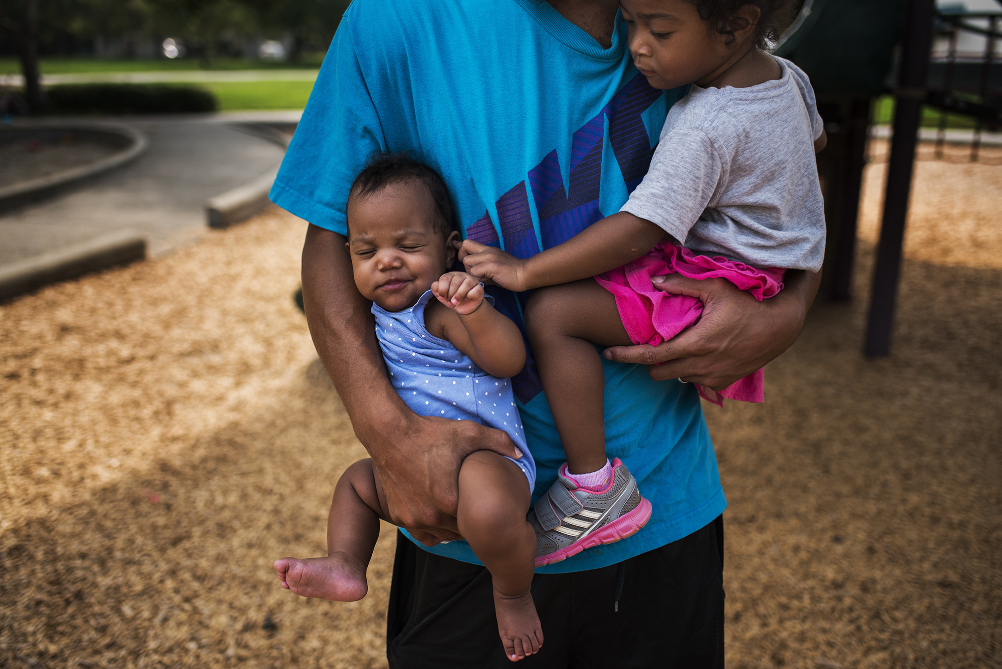 parent holding baby and toddler - Documentary Family Photography