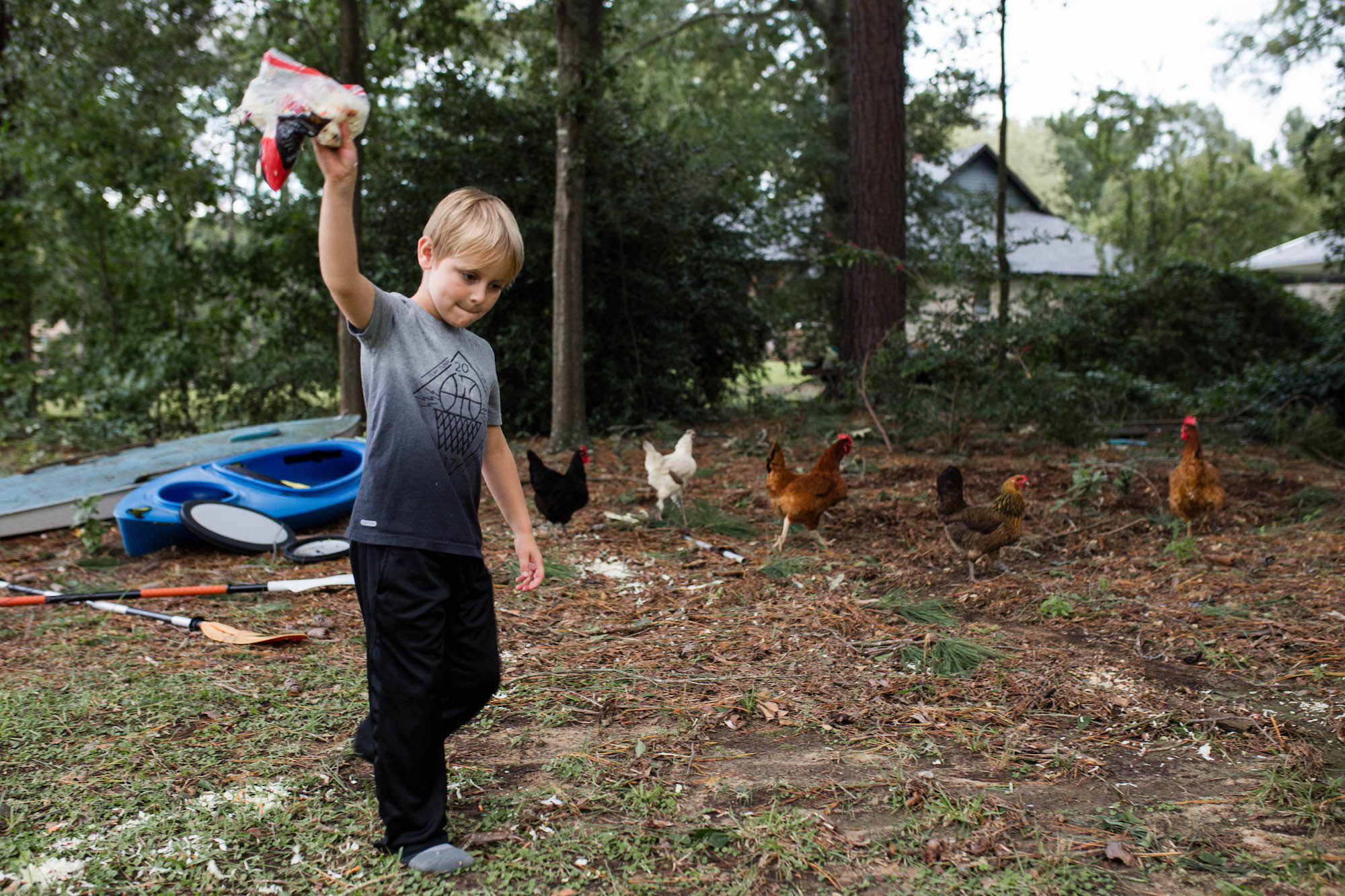 boy throwing toy outside - Documentary Family Photography