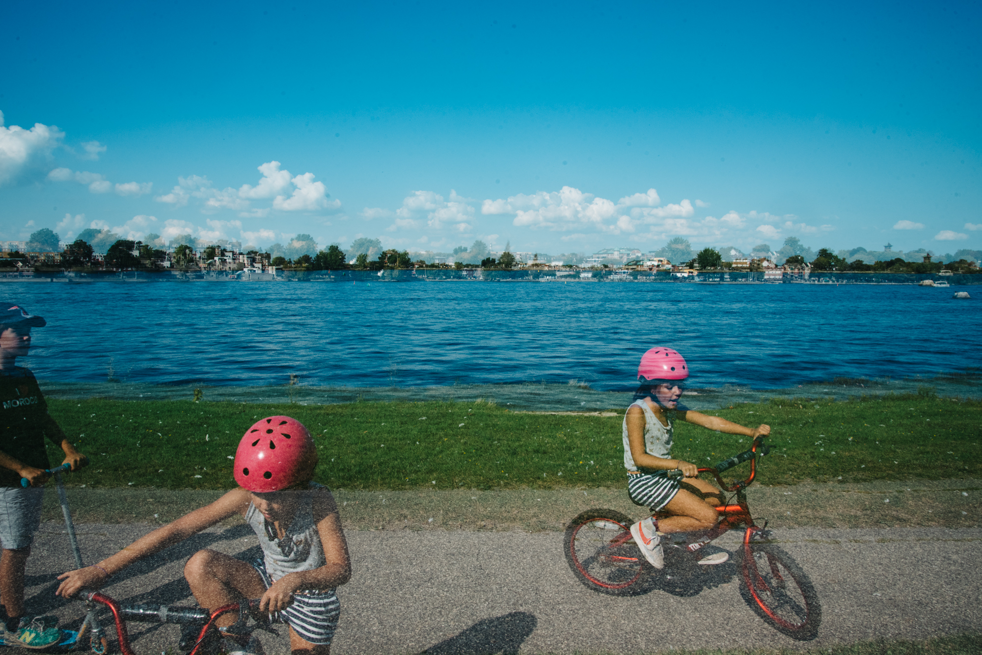 kids on bikes near lake - Documentary Family Photography