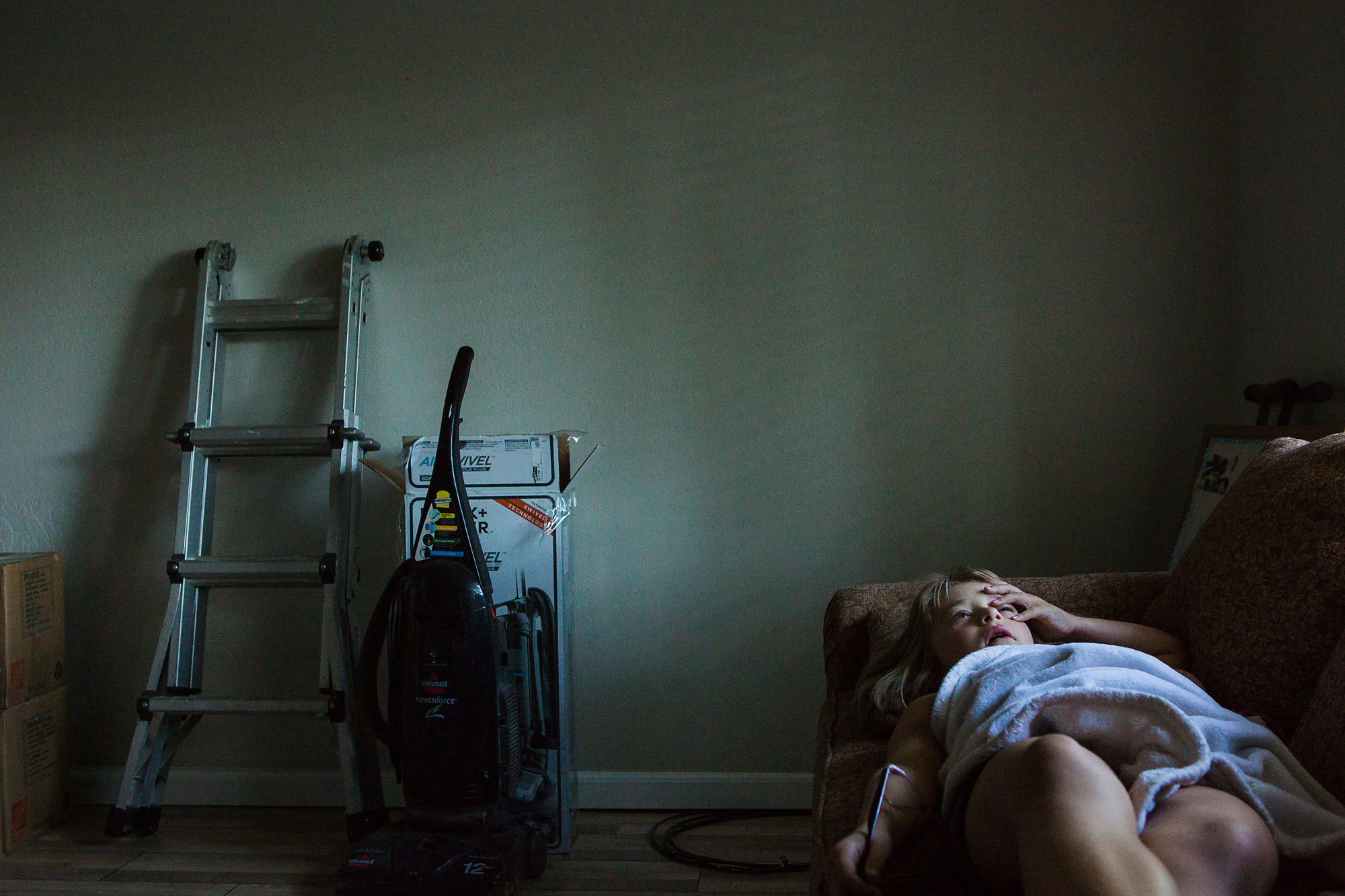 girl laying on couch - Documentary Family Photography