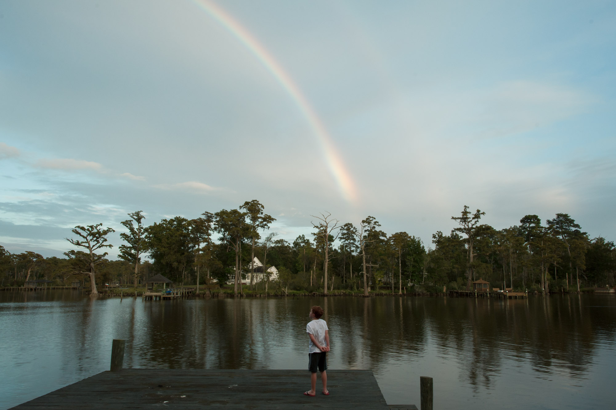 rainbow over dock and boy - Documentary Family Photography