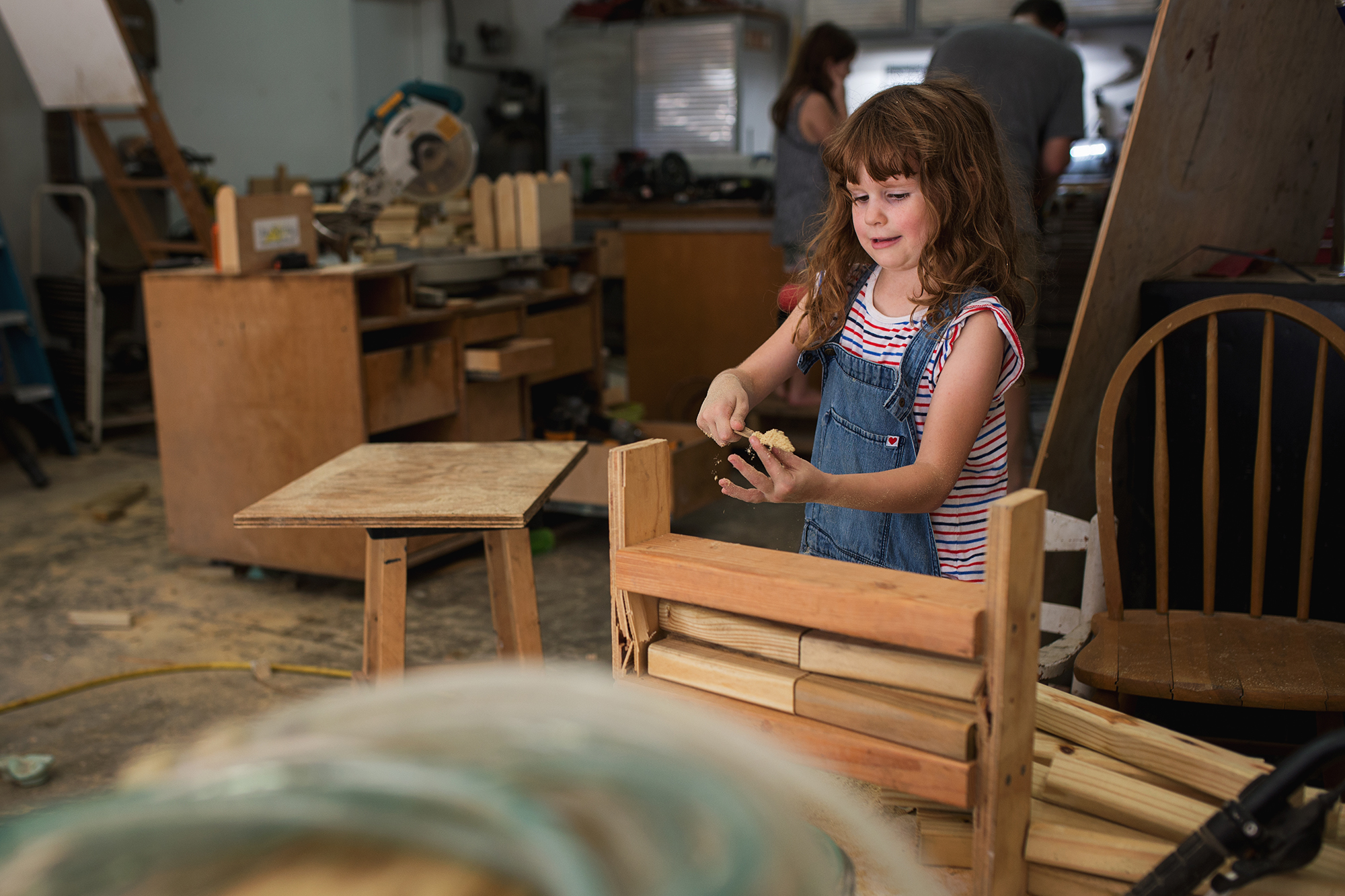 girl with woodwork - Documentary Family Photography