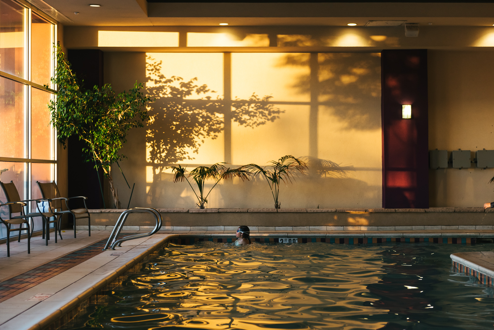 kid in pool at sunset - Documentary Family Photography