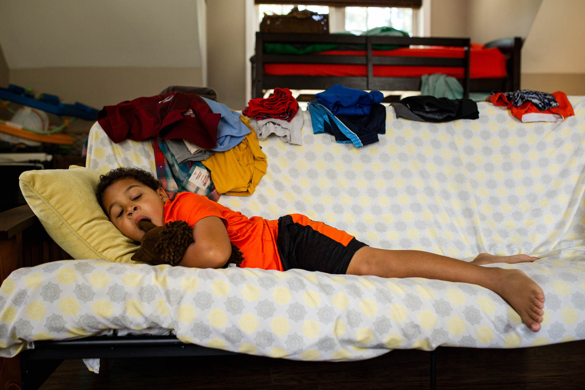 boy in bed yawning -Documentary Family Photography