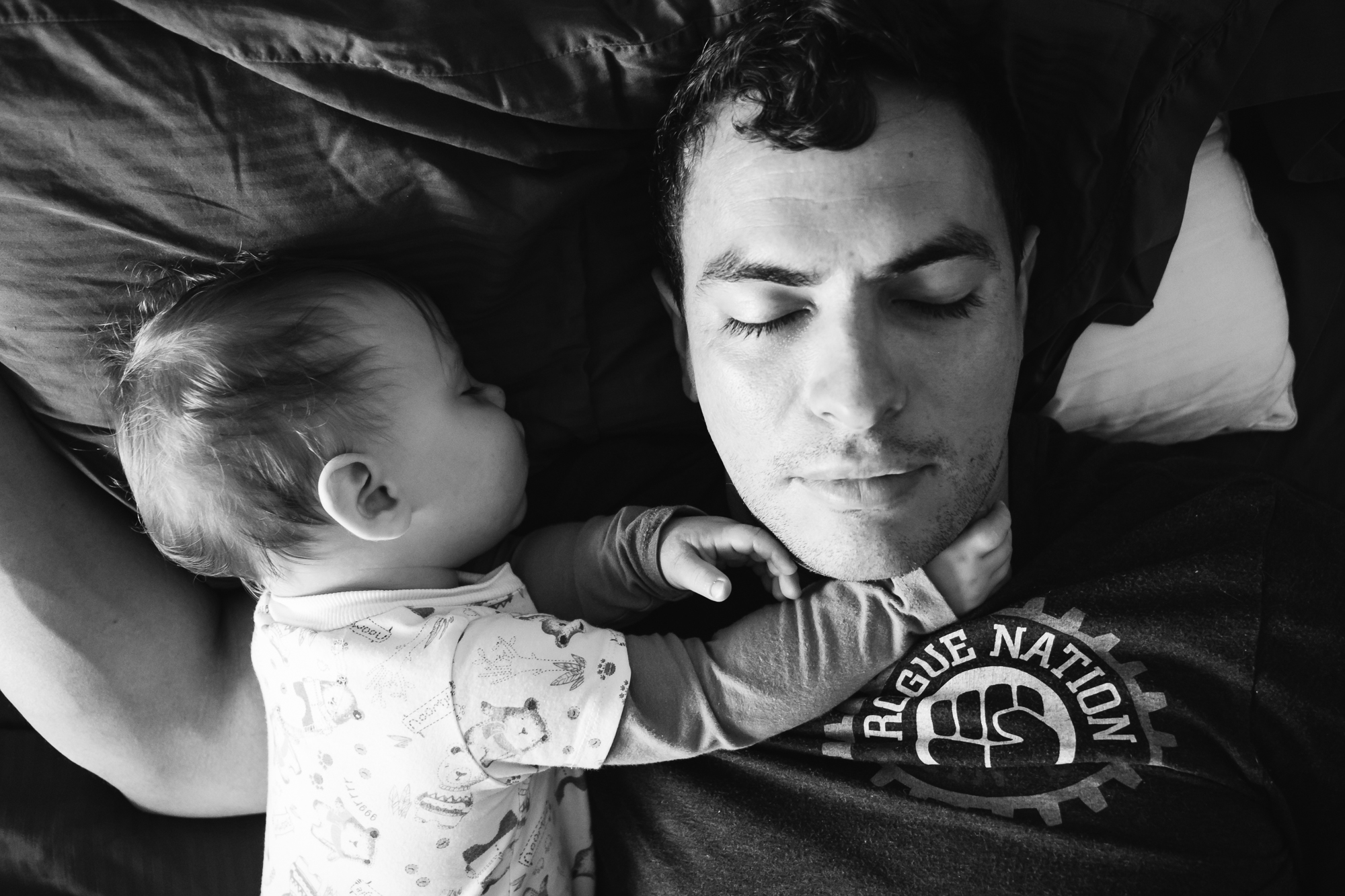 baby asleep with father - Documentary Family Photography