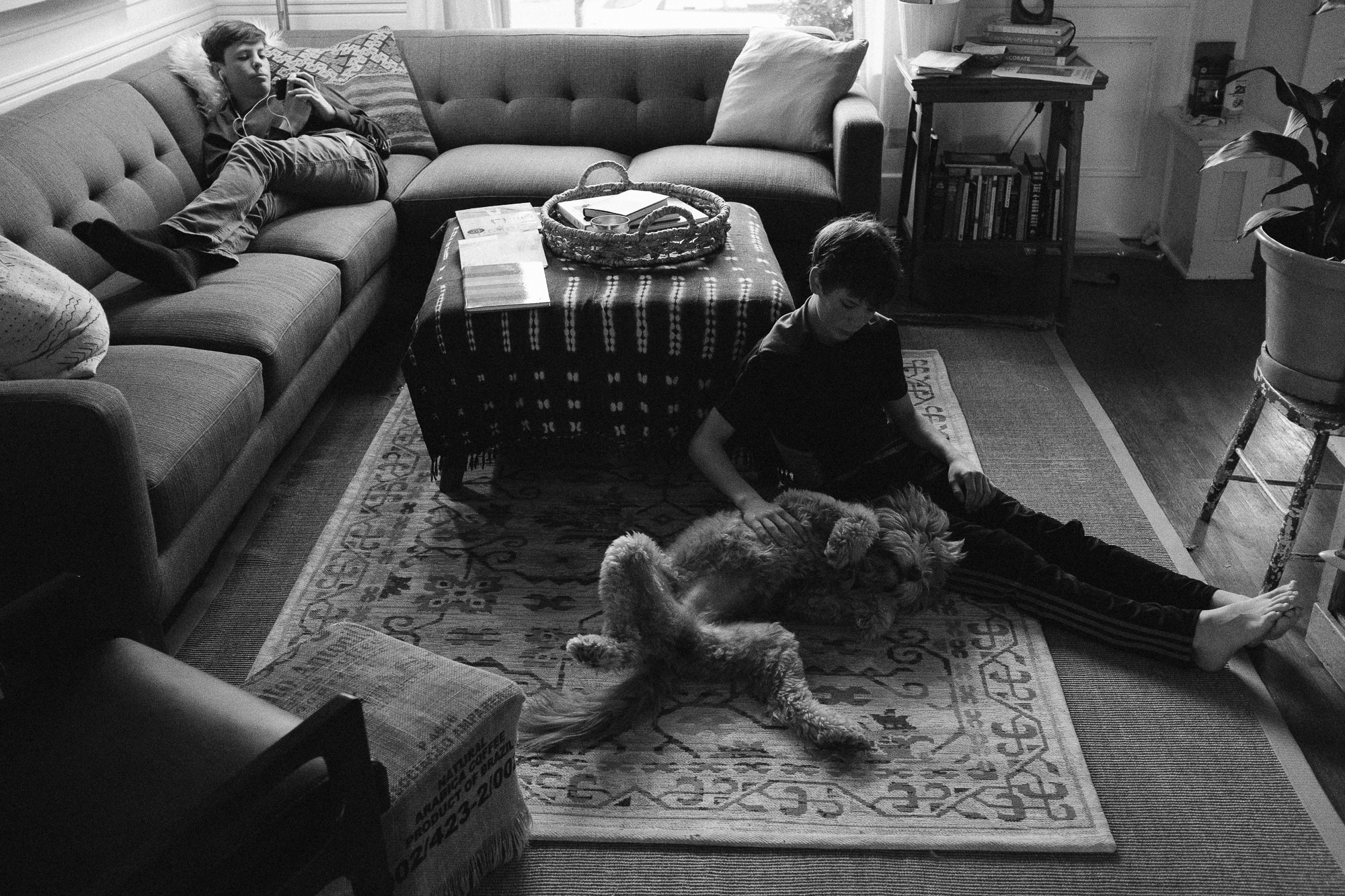 boy on floor with dog - Documentary Family Photography