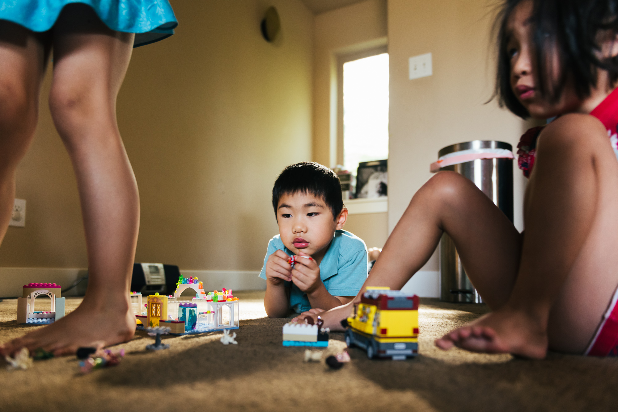 boy on floor with legos - Documentary Family Photography