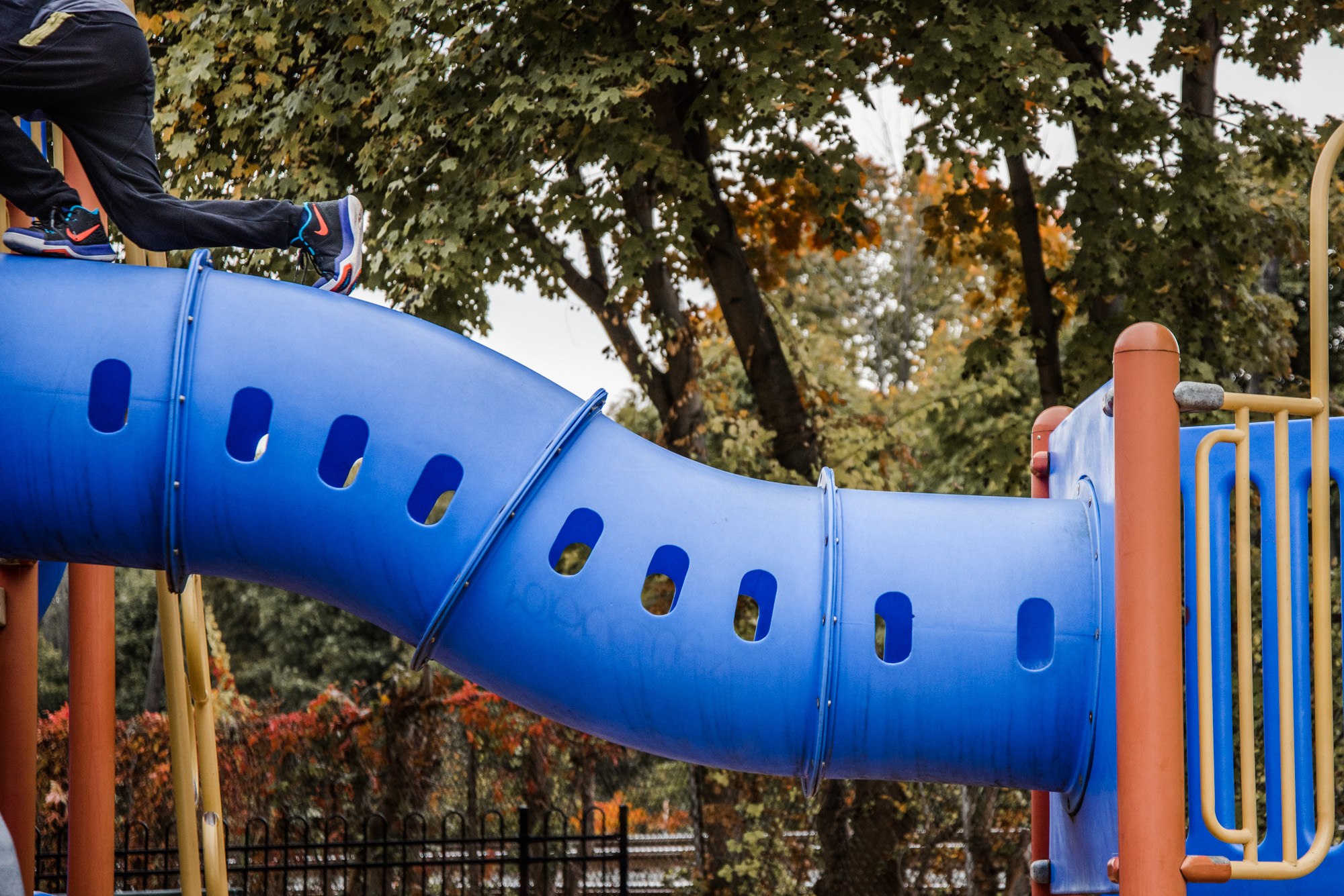 child climbing on top of playground equipment - Documentary Family Photography