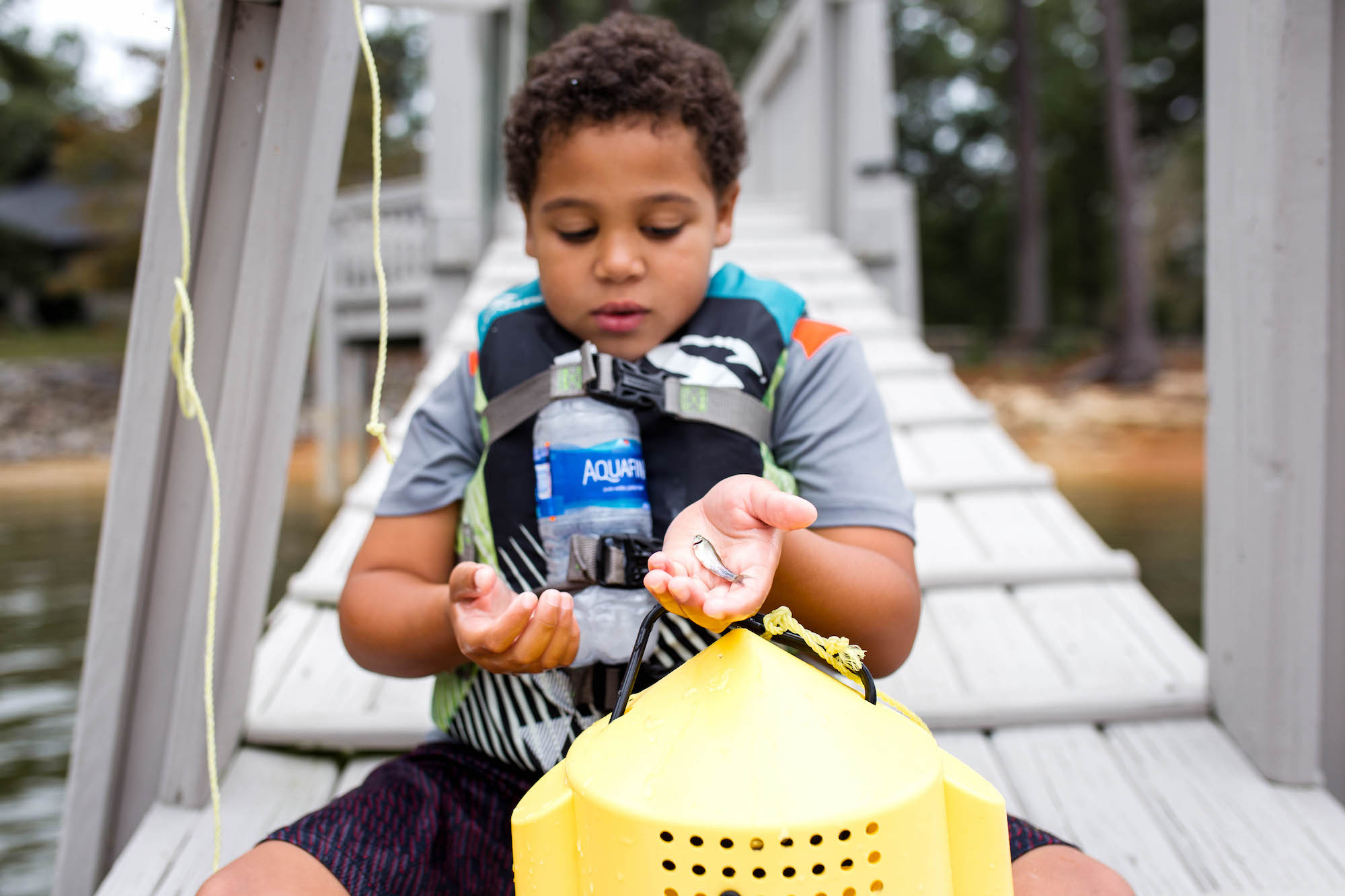 boy in live vest - documentary family photography