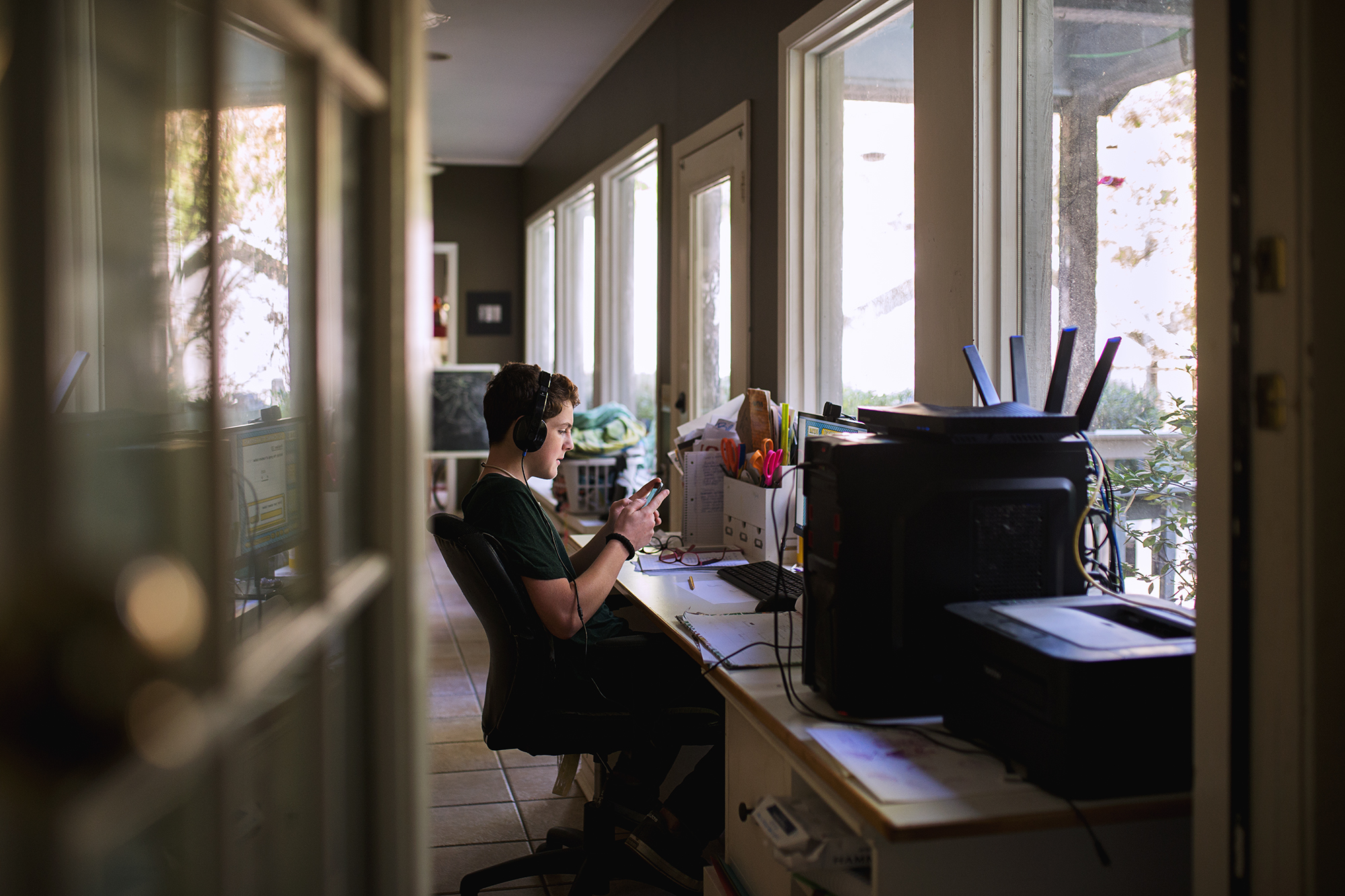 teen works at computer - documentary family photography