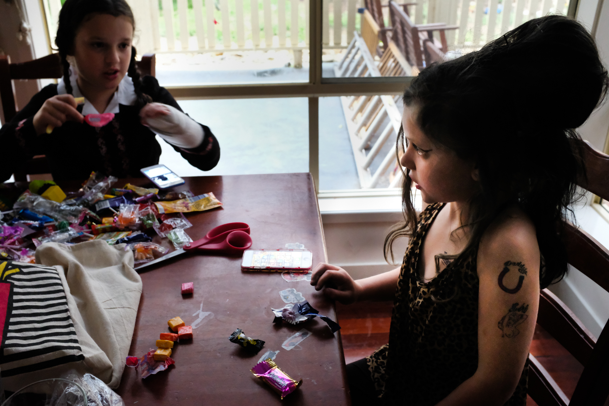 kids with Halloween candy - documentary family photography
