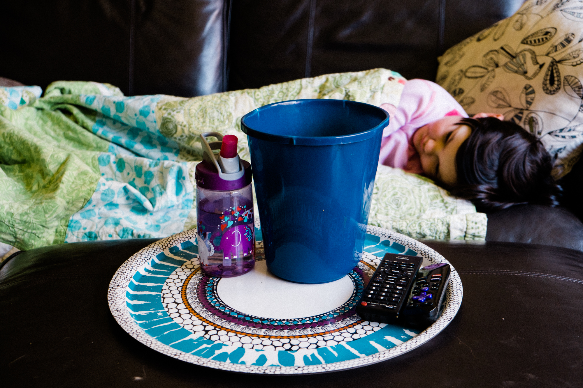 girl with sick bucket -documentary family photography