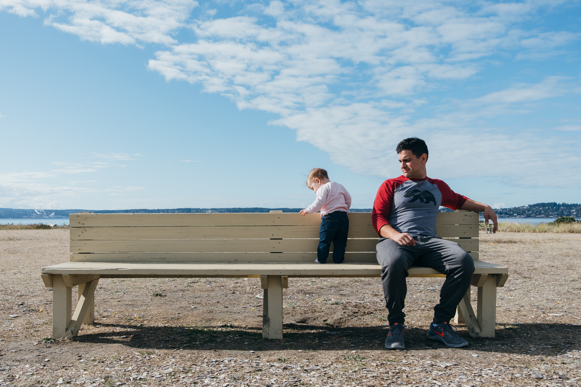 father and baby on bench - documentary family photography