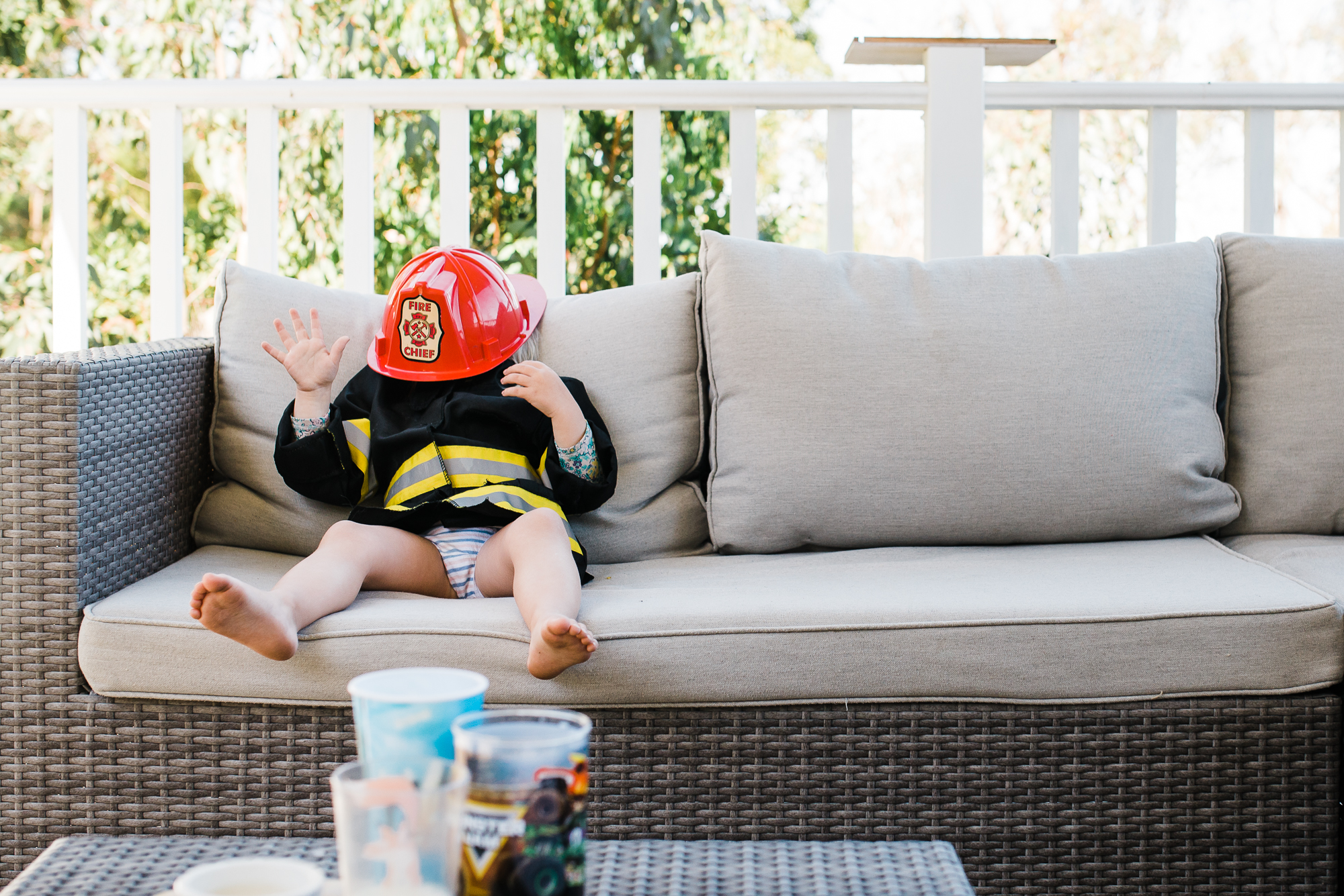 kid in fireman outfit - documentary family photography