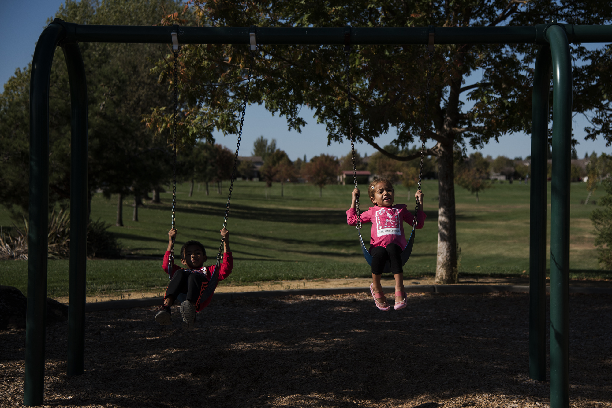 kids on swings - documentary family photography