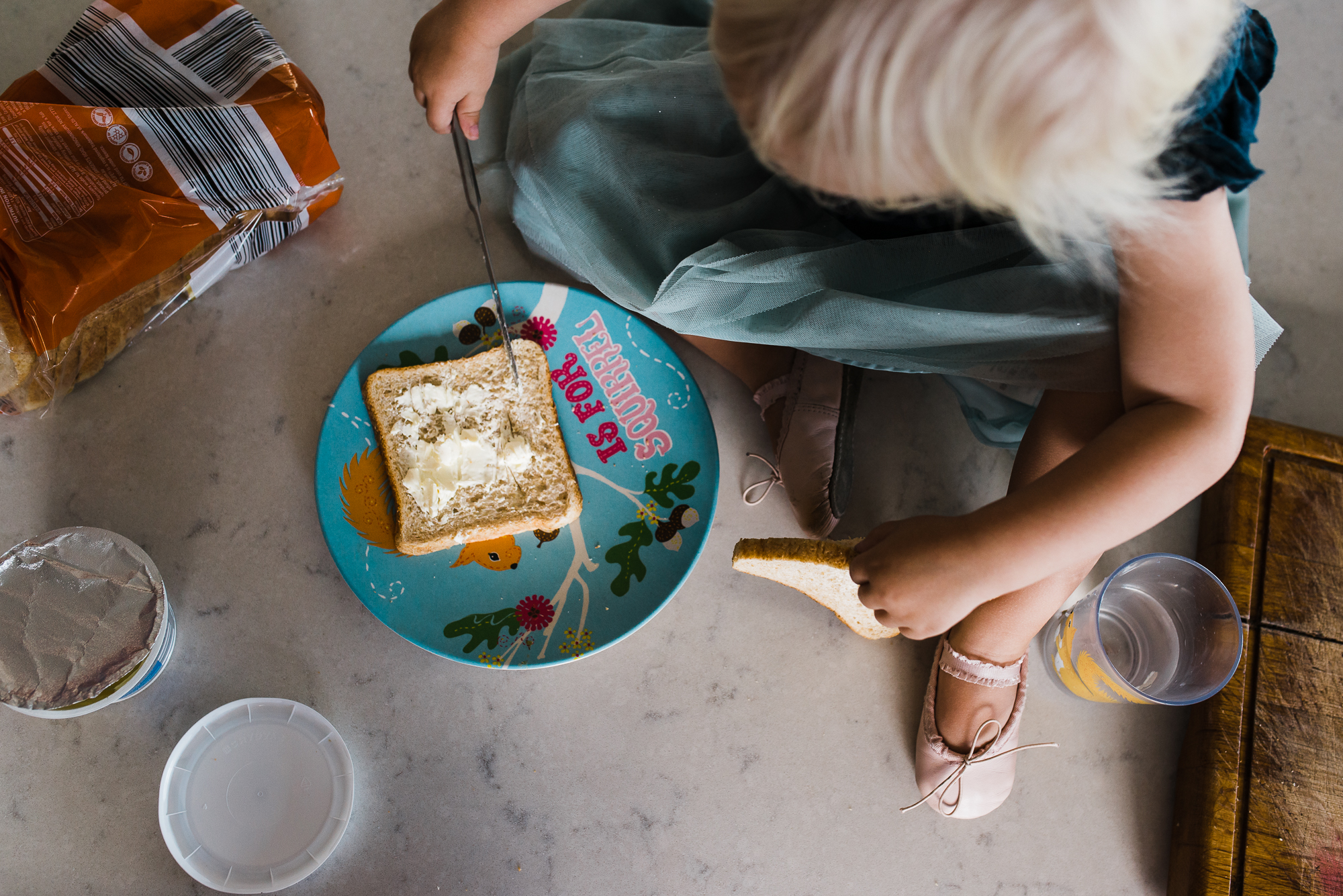 child with bread and butter - documentary family photography