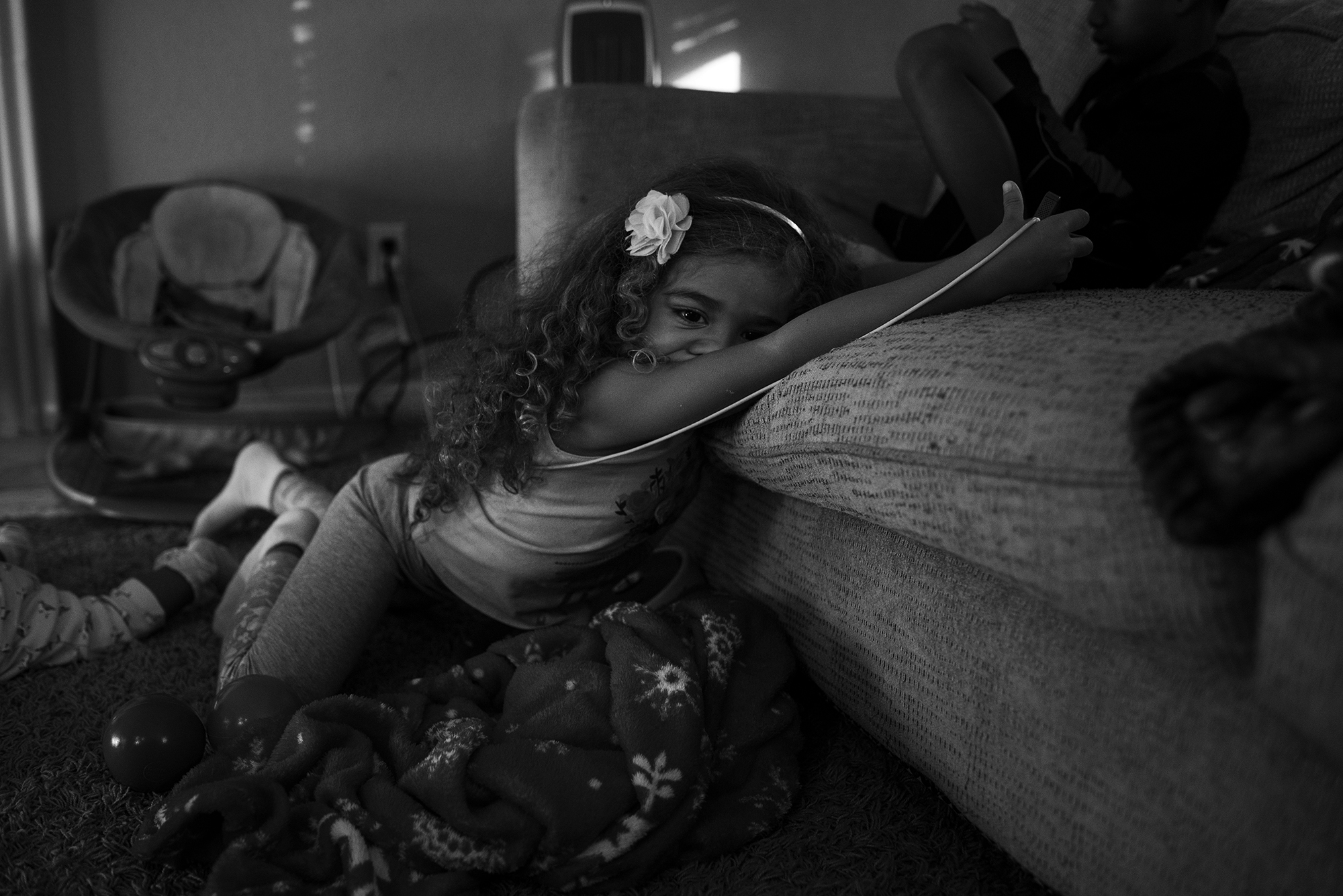 girl sprawled on couch - Documentary Family Photography
