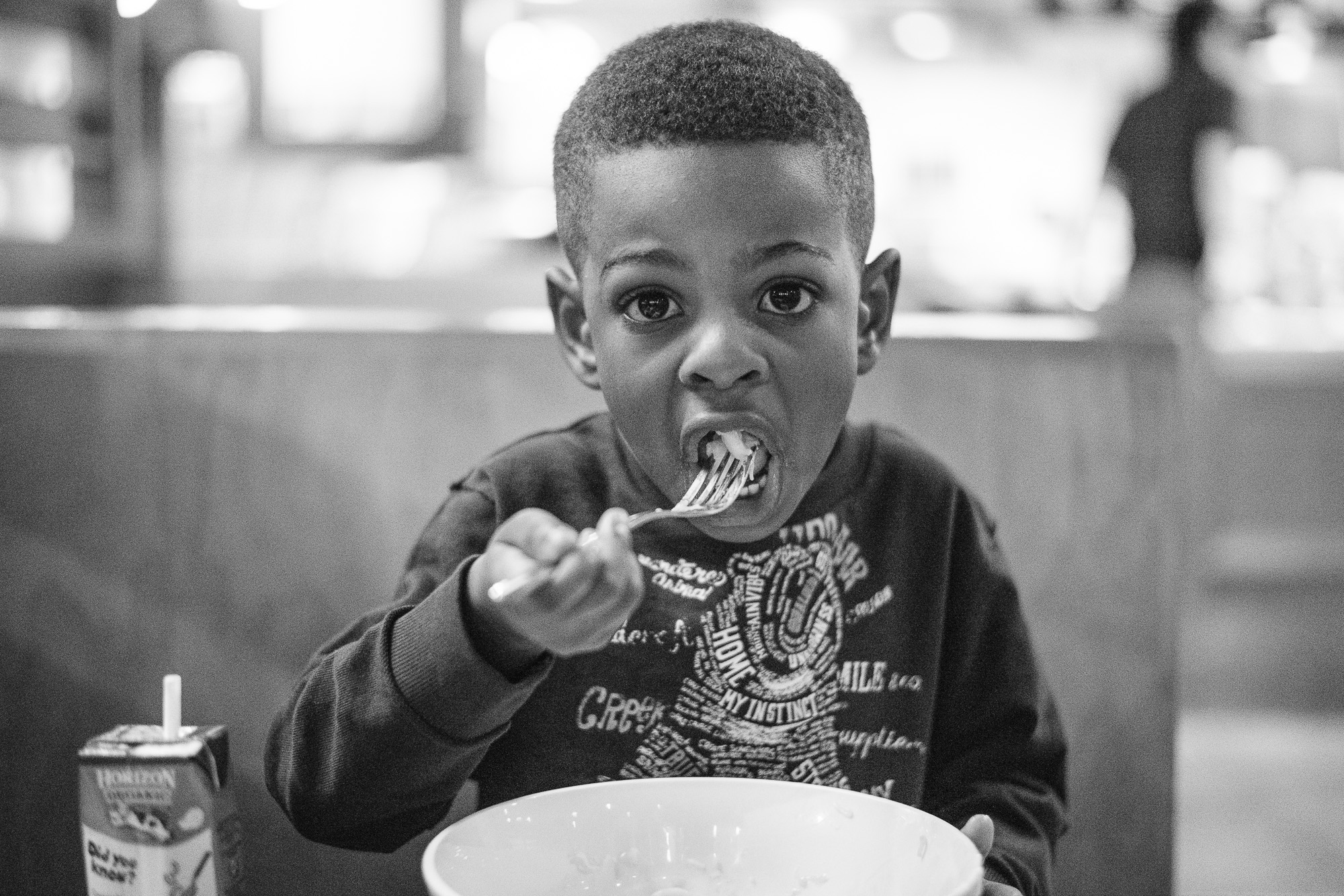 boy eating from bowl - Documentary Family Photography