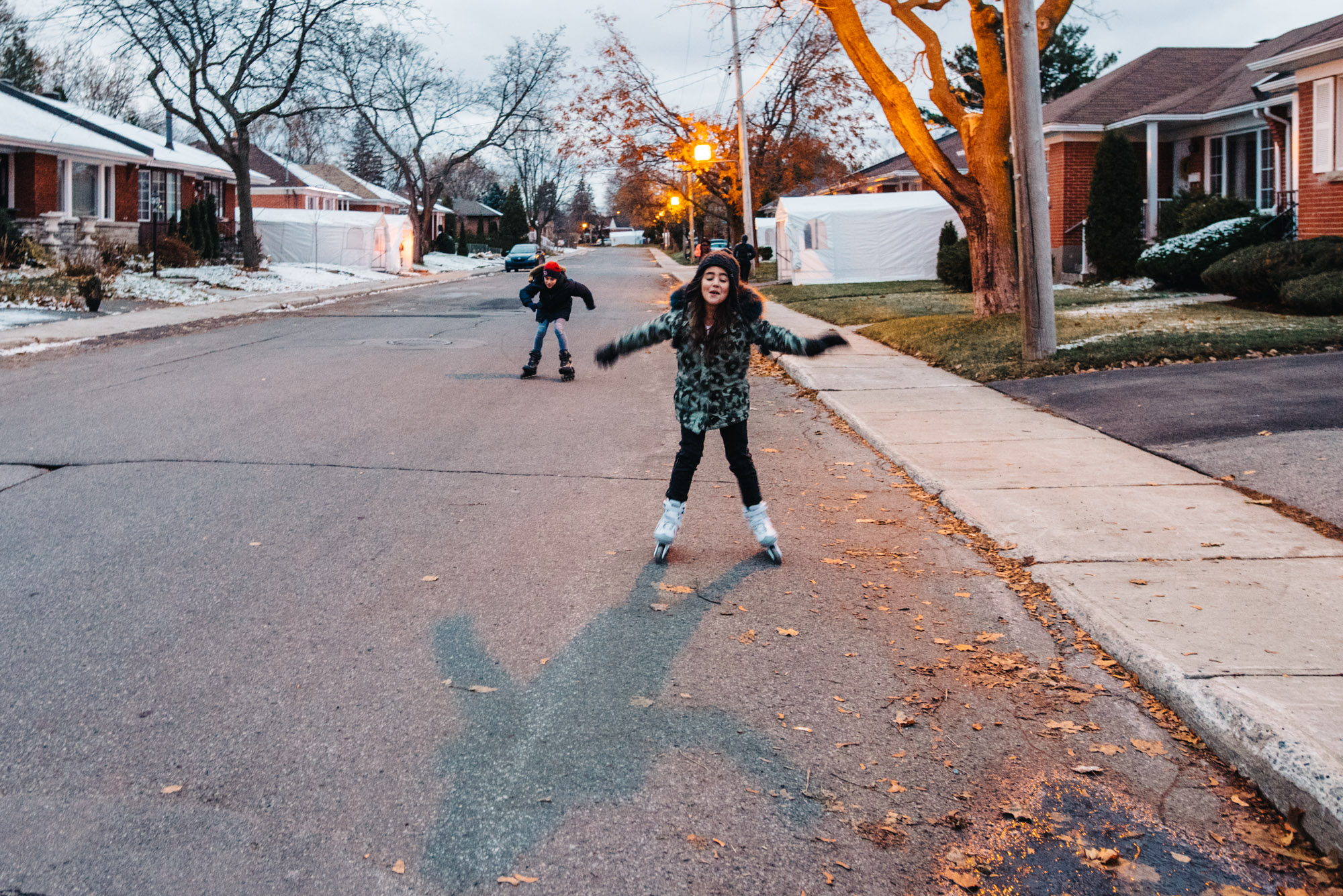 kids rollerskating in street - Documentary Family Photography