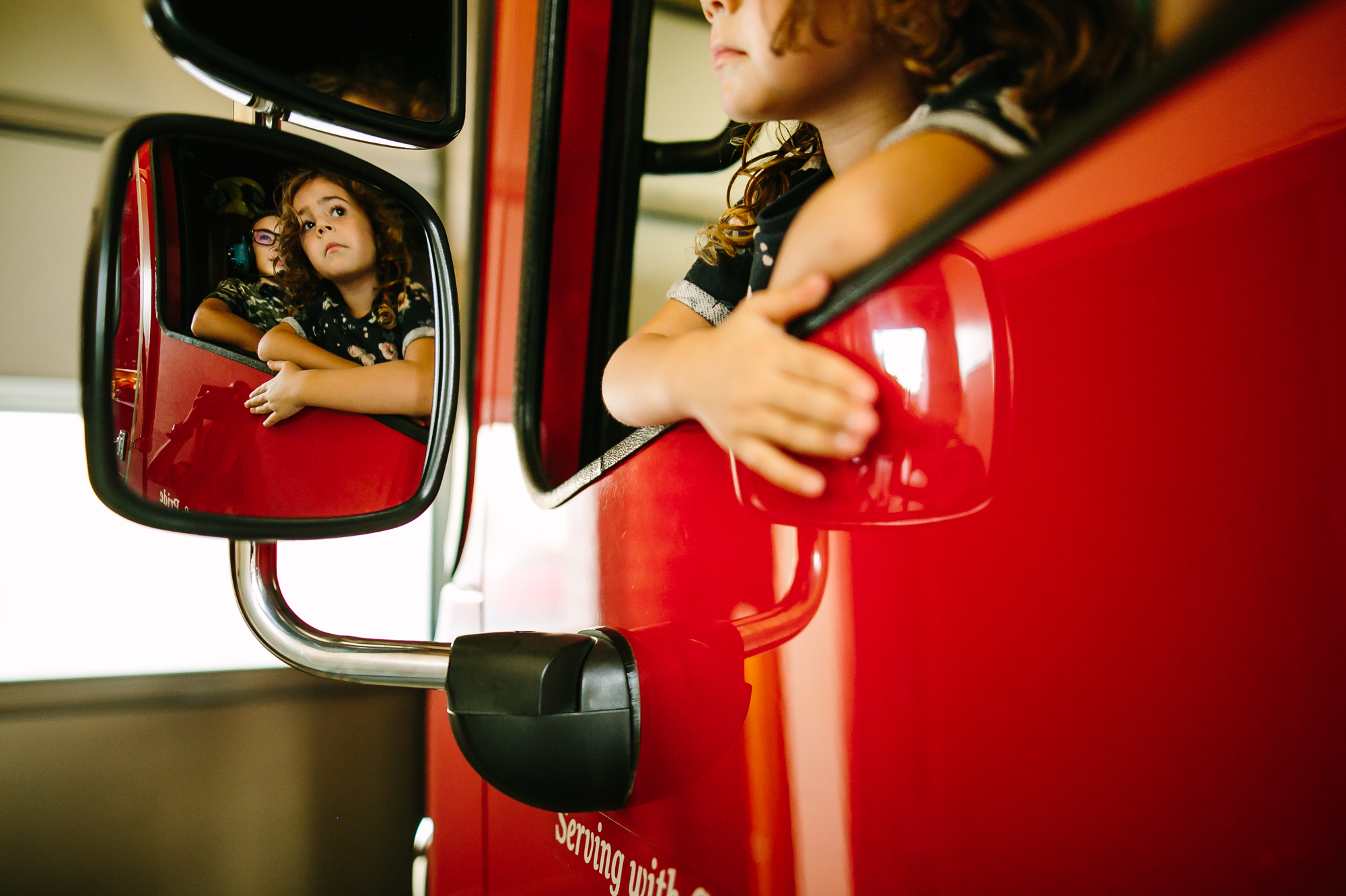 girl in fire truck - Documentary Family Photography