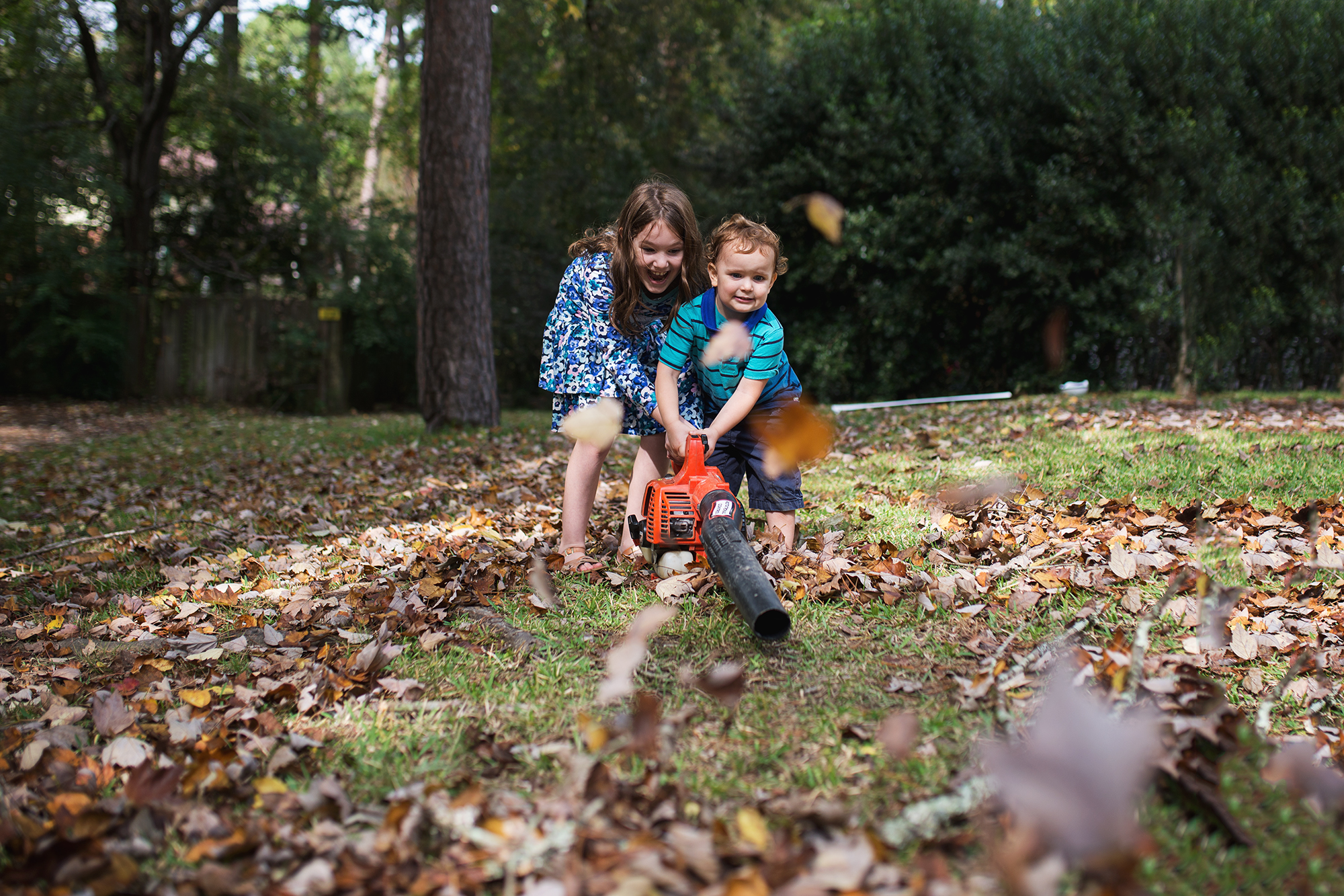 kids with leaf blower - Documentary Family Photography