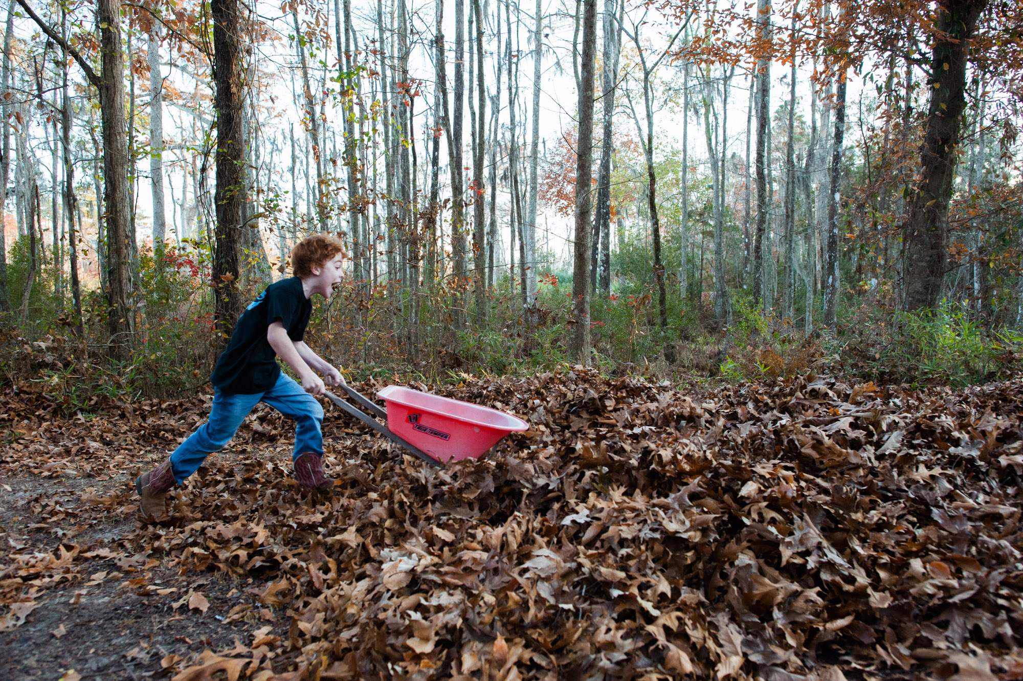 boy with wheel barrow - Documentary Family Photography