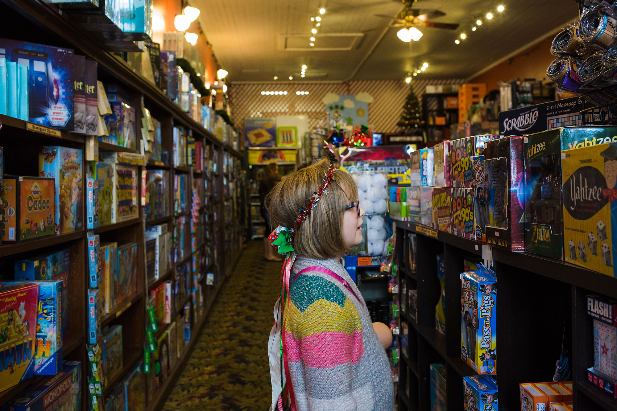 girl looks at aisle in store - Documentary family photography