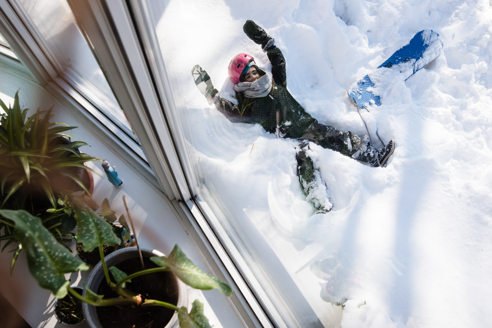 girl making snow angels - Documentary Family Photography