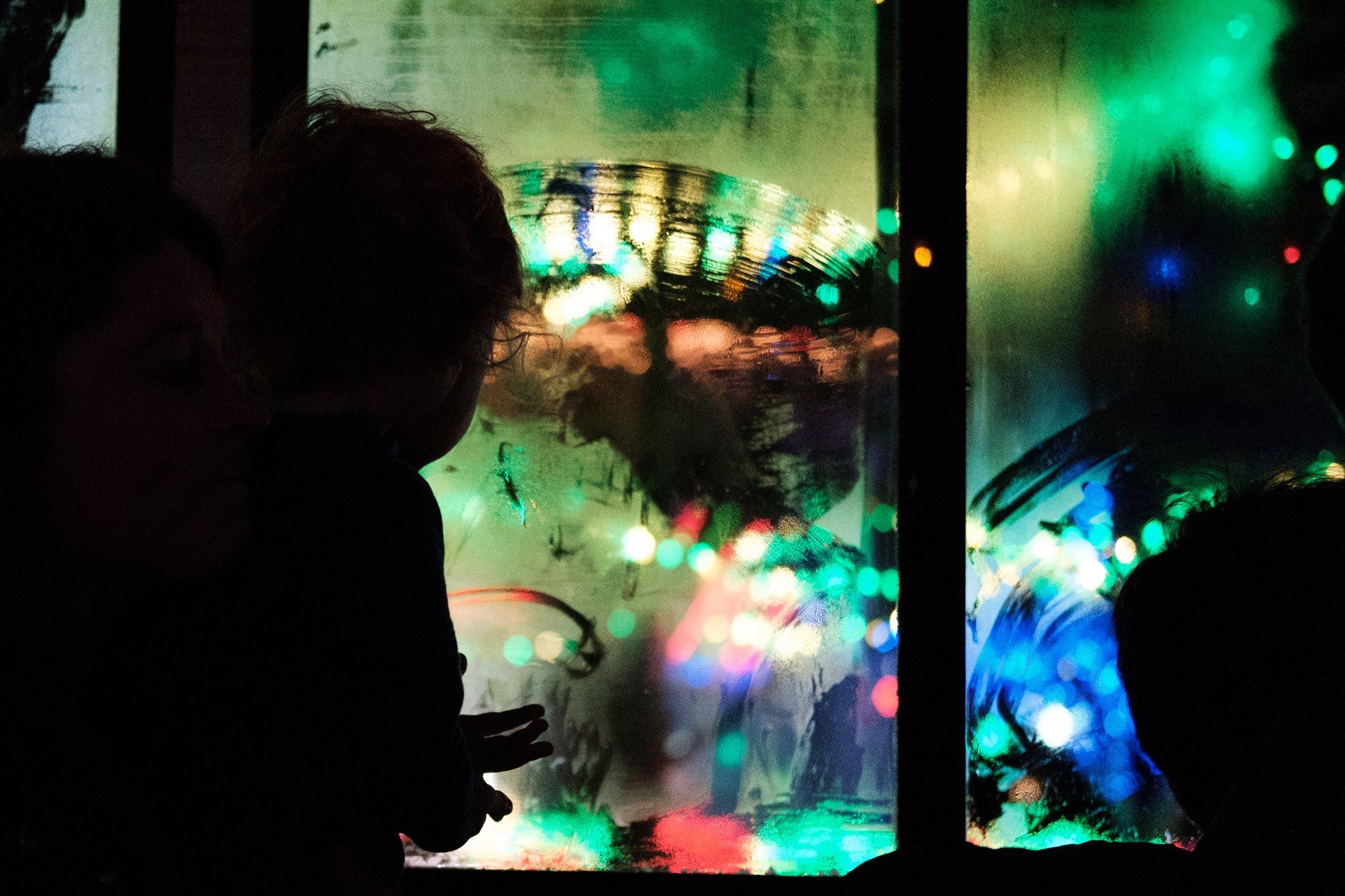 child silhouette at fogged window - Documentary Family Photography