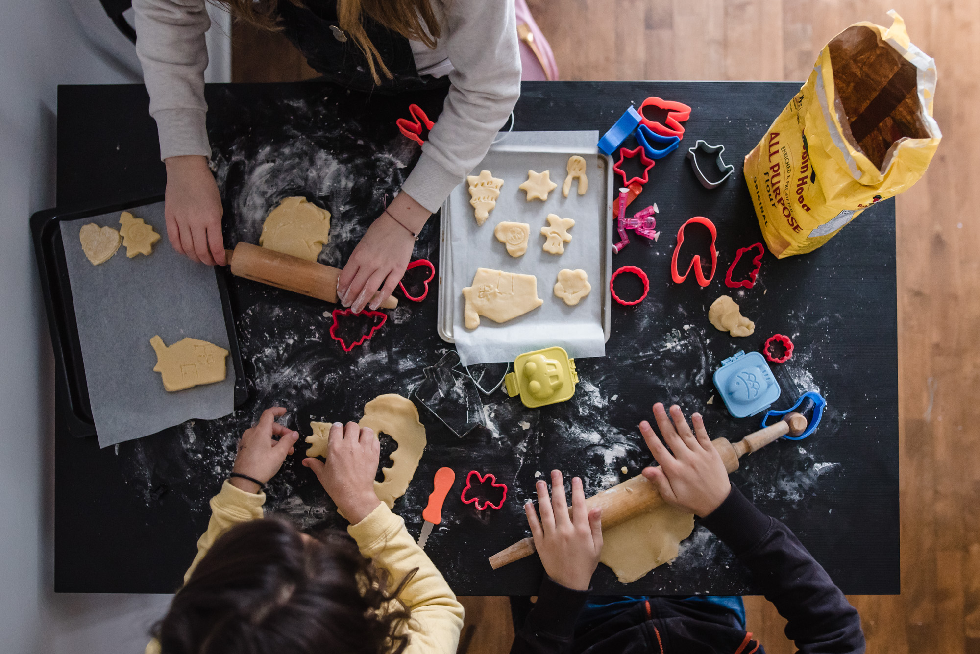 overhead shot of kids making cookies - Documentary Family Photography