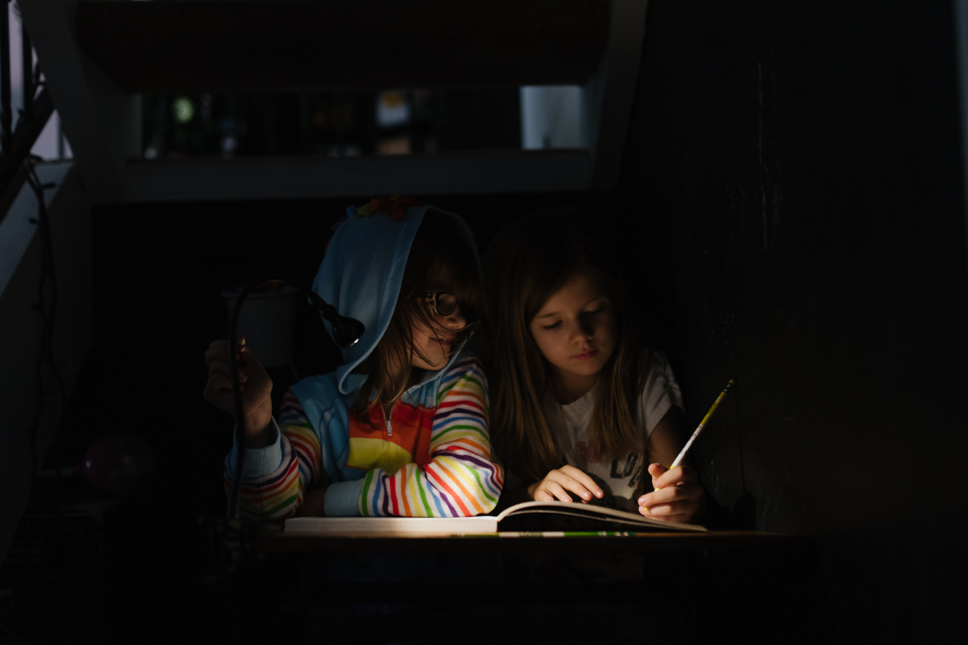 kids reading in the dark - Documentary Family Photography