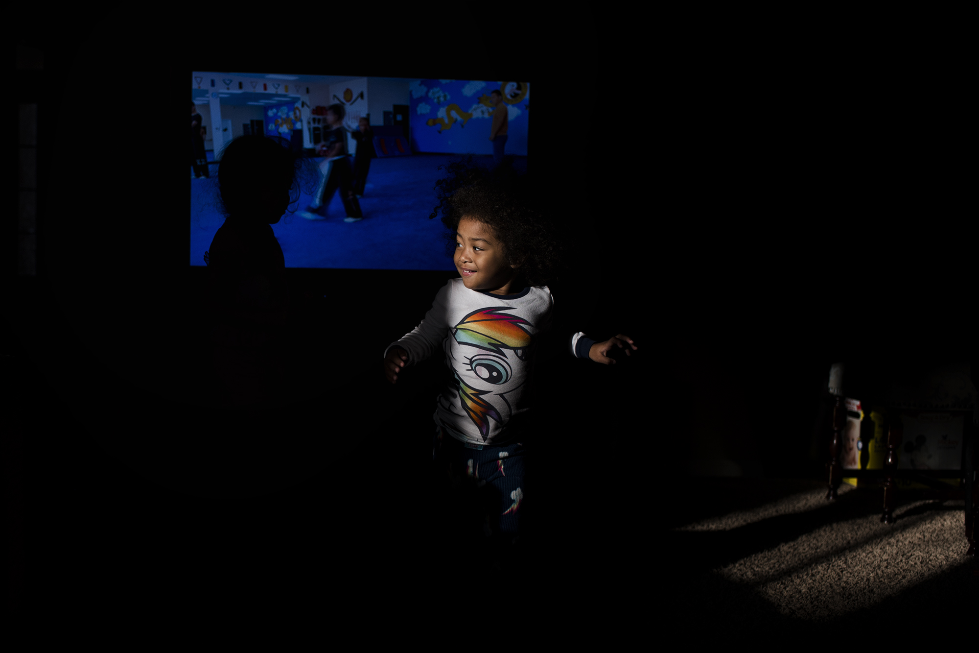 child in spot of sunlight -Documentary Family Photography