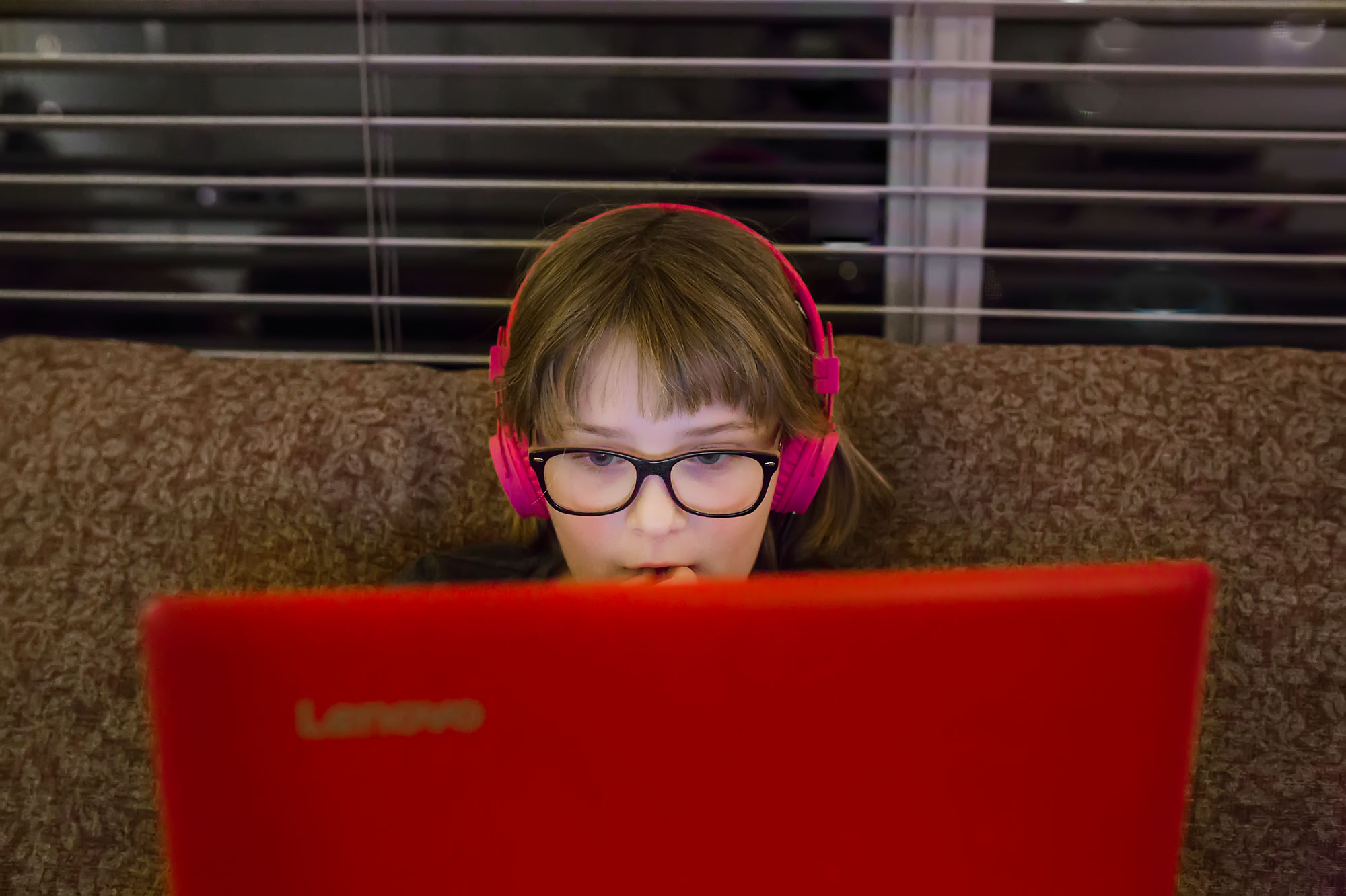 girl with laptop and headphones - Documentary Family Photography