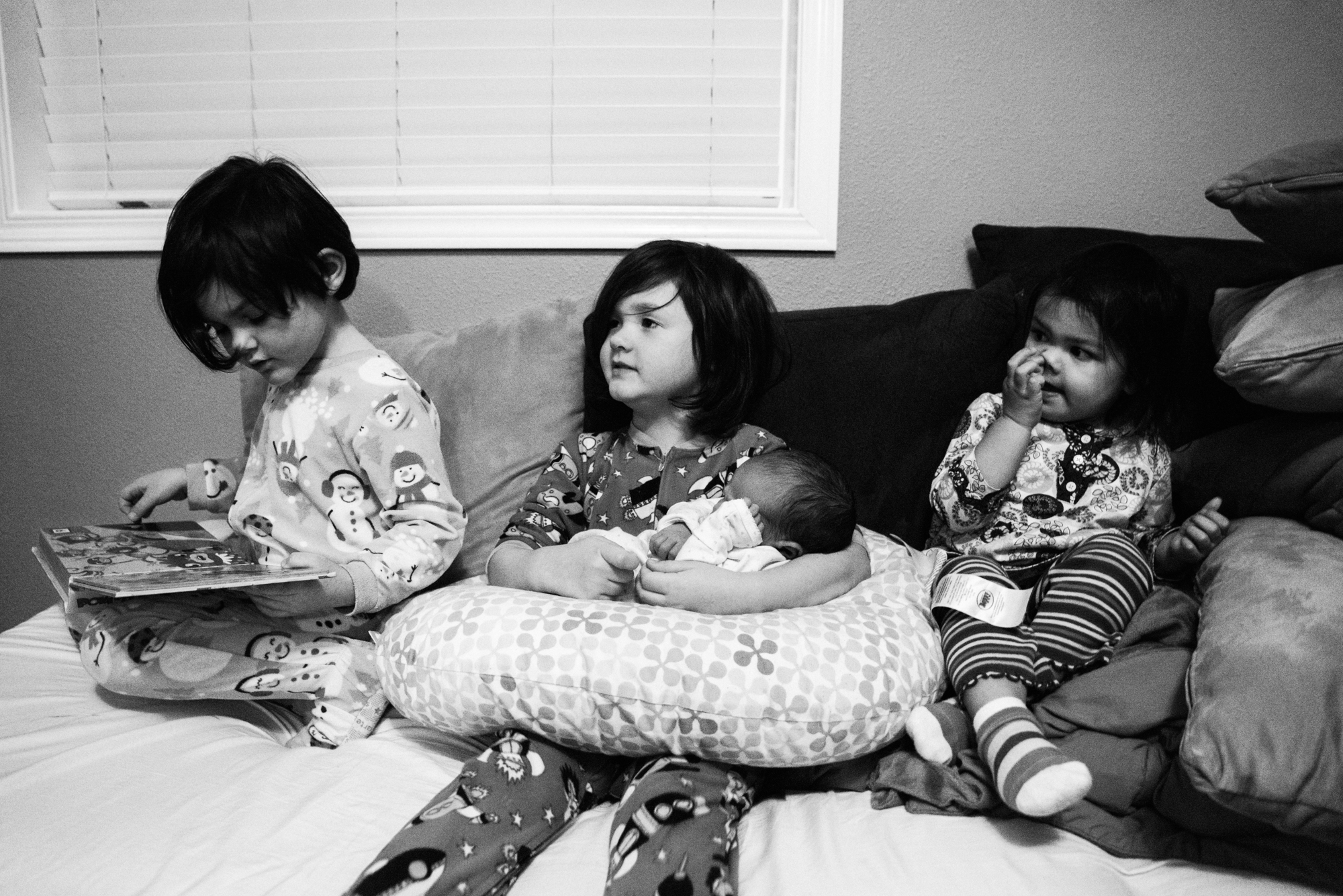 kids hold new baby - Documentary Family Photography