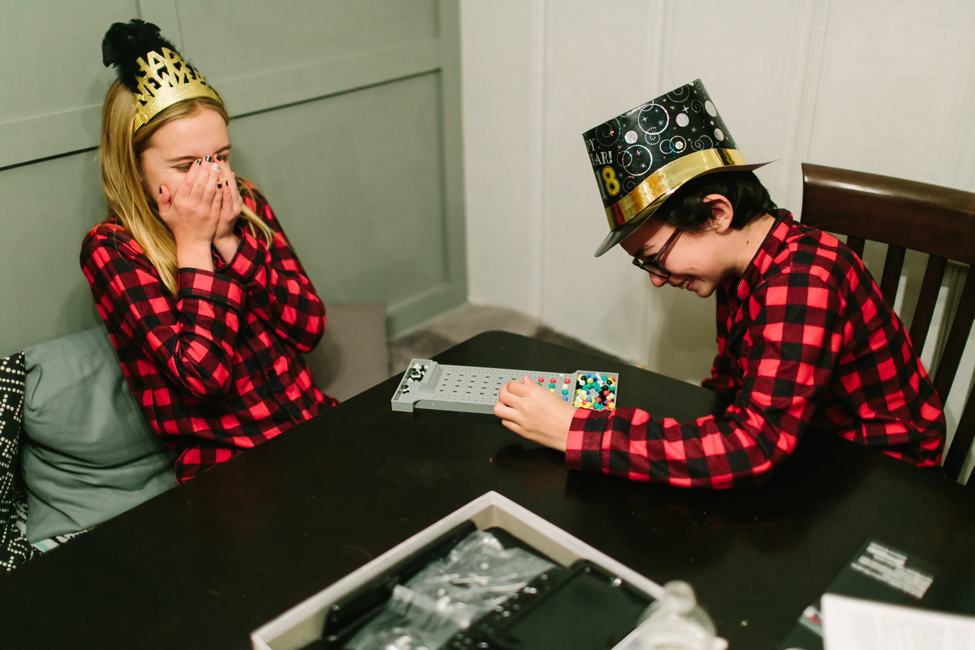 kids play game in matching pajamas - Documentary Family Photography