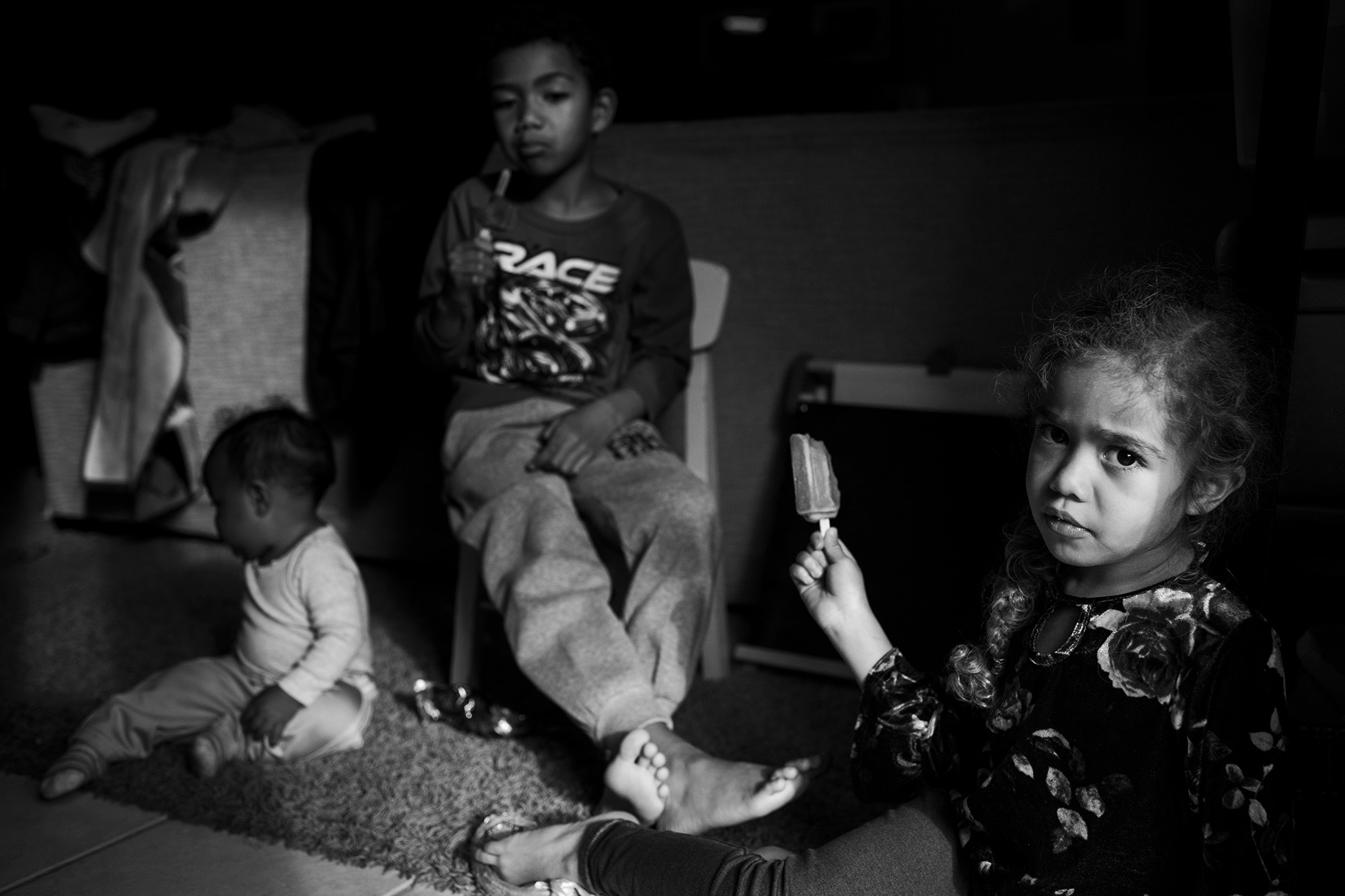 kids staring intently - Documentary Family Photography