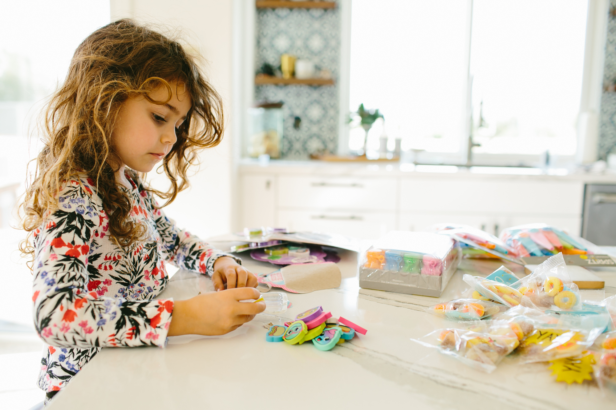 girl does crafts in kitchen - documentary family photography