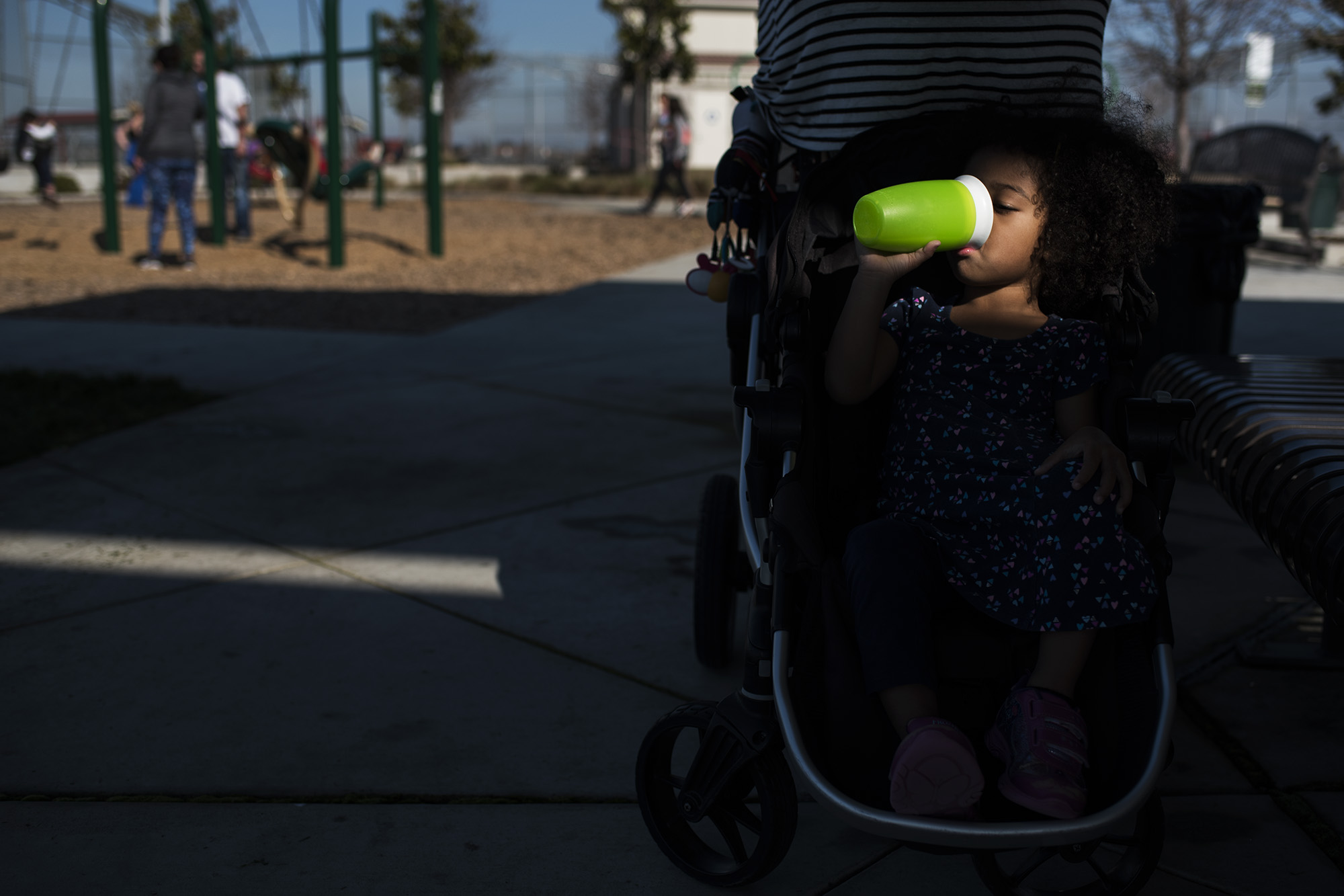 girl drinking from plastic cup - Documentary Family Photography