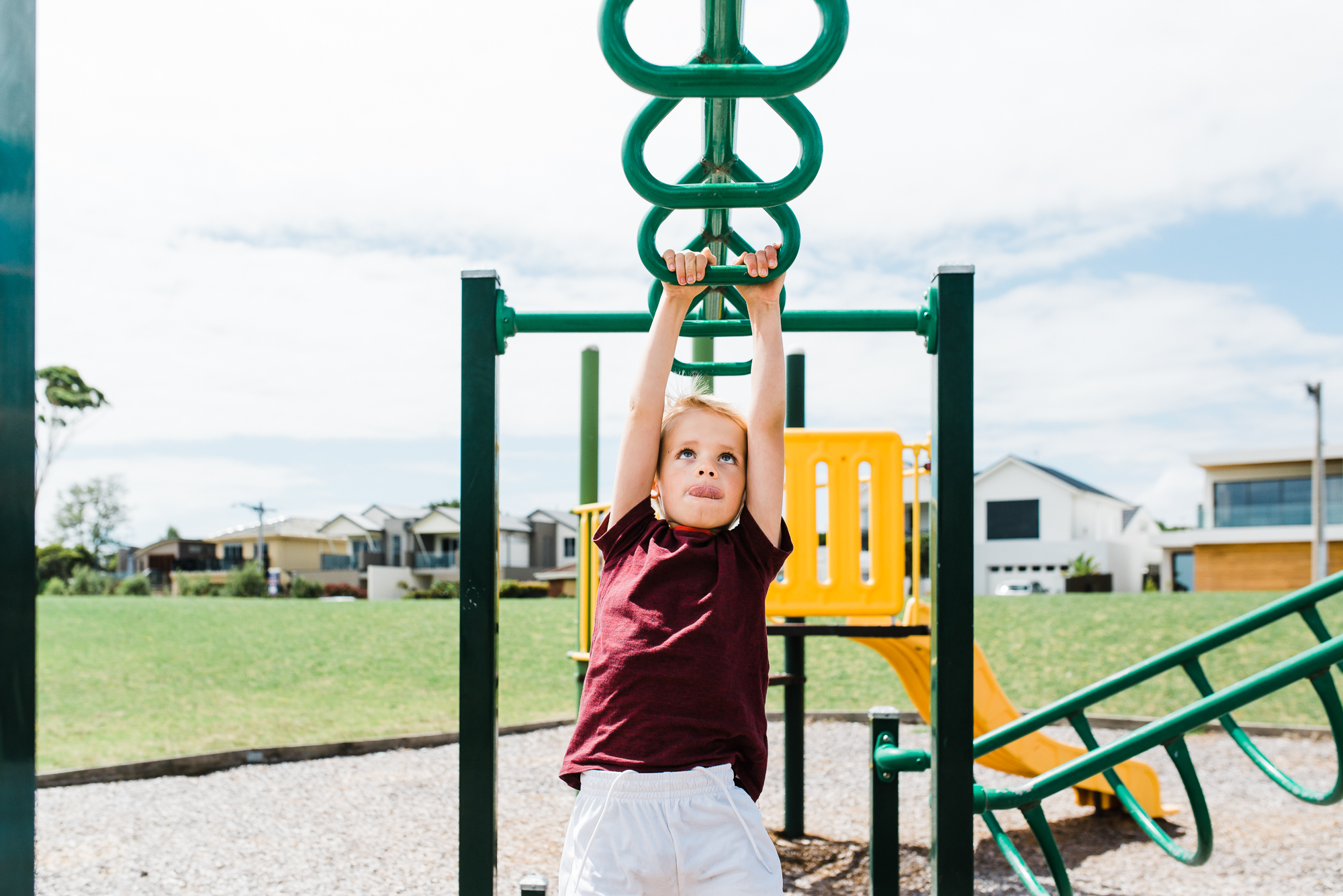 boy on monkey bars - Documentary Family Photography