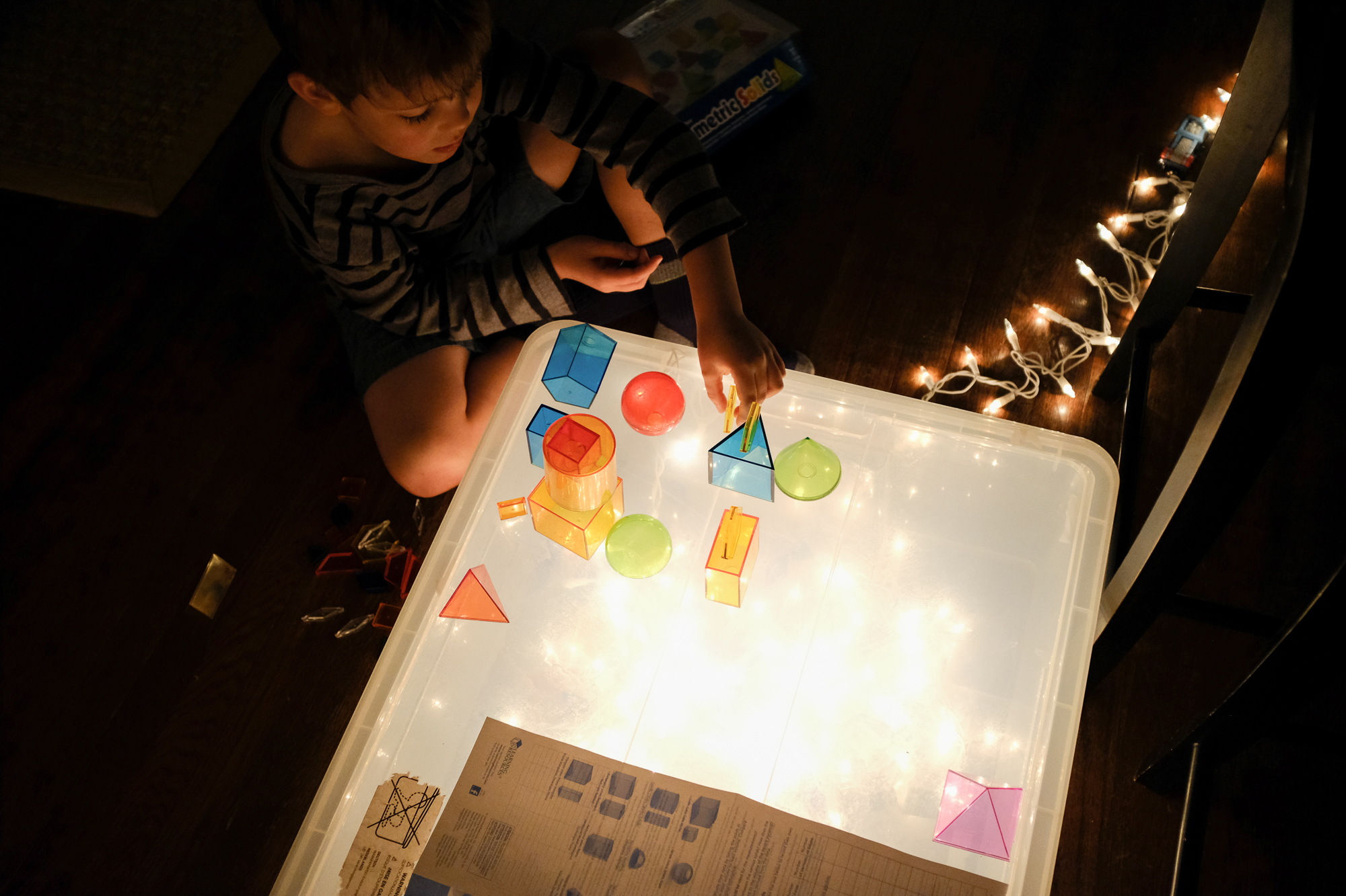 boy at light table - Documentary Family Photography