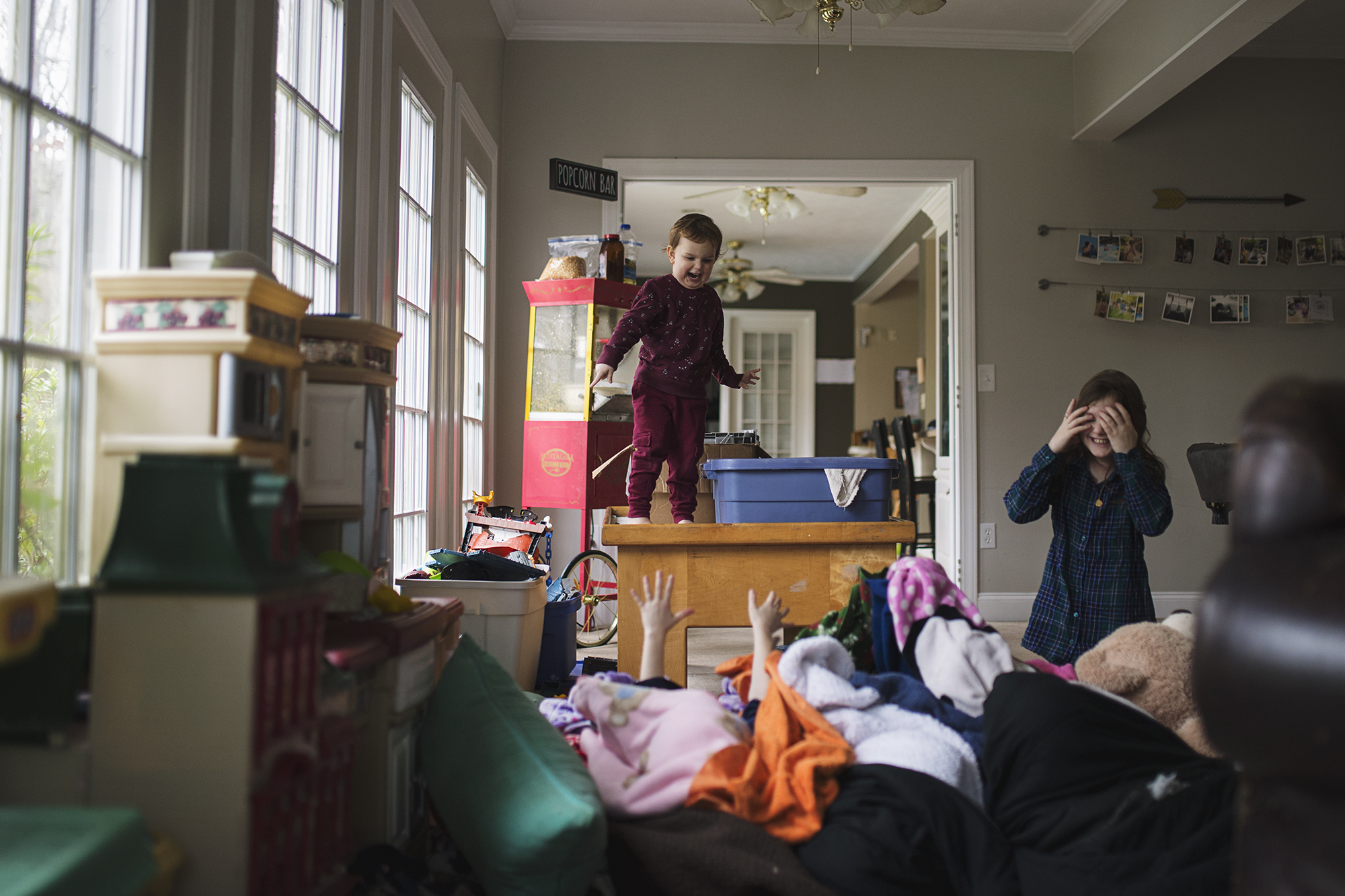 kids climbing on furniture - Documentary Family Photography