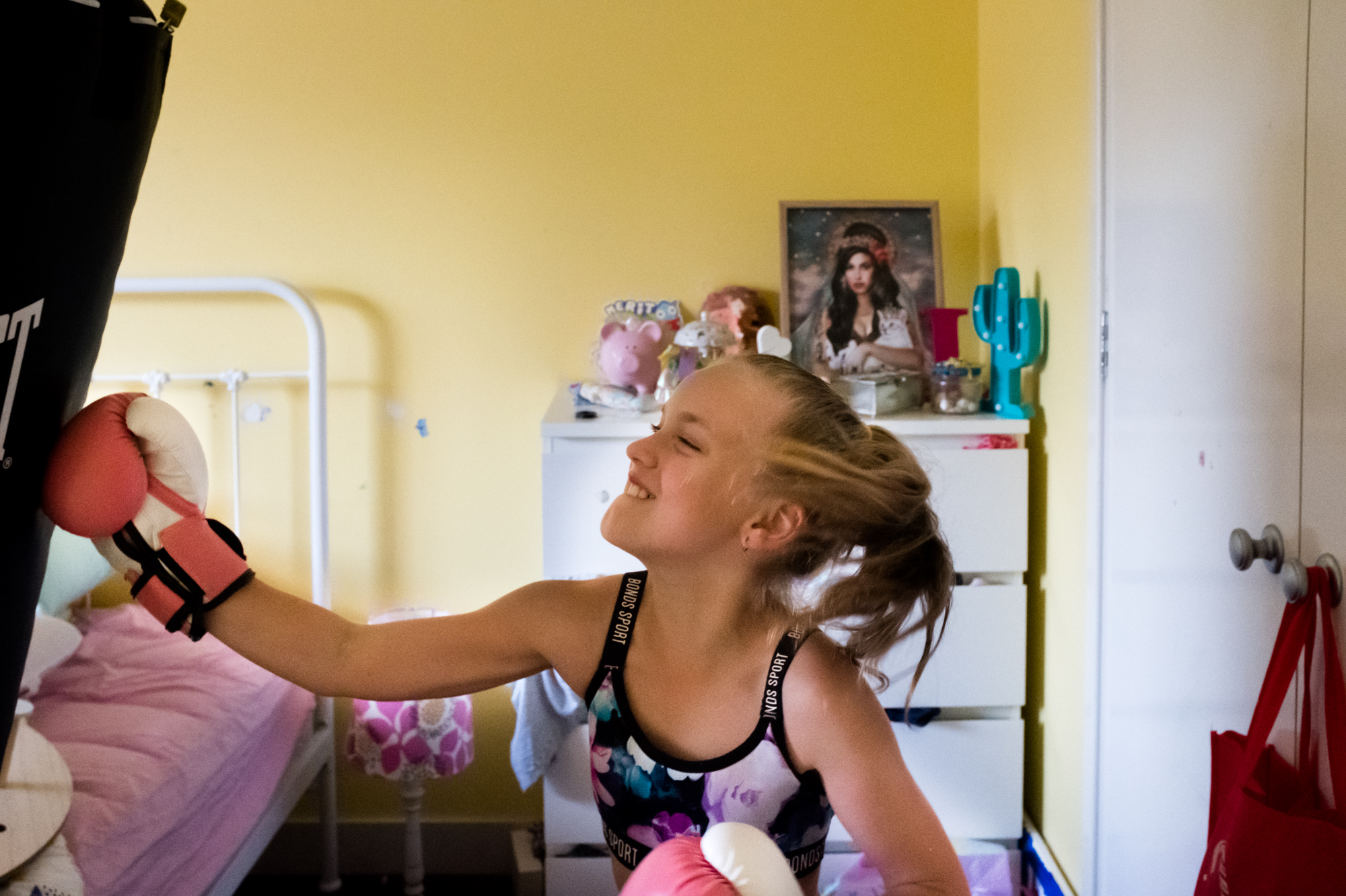 girl with punching bag - Documentary Family Photography