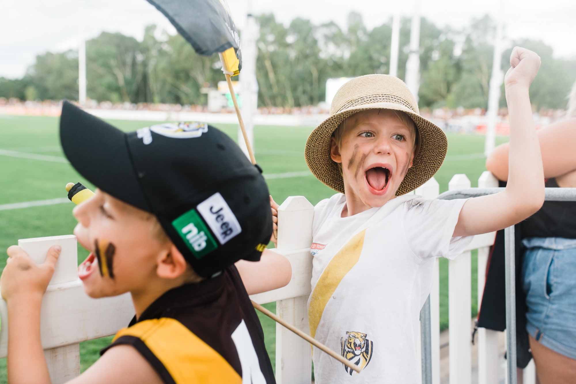 boys cheer on sports team - Documentary Family Photography