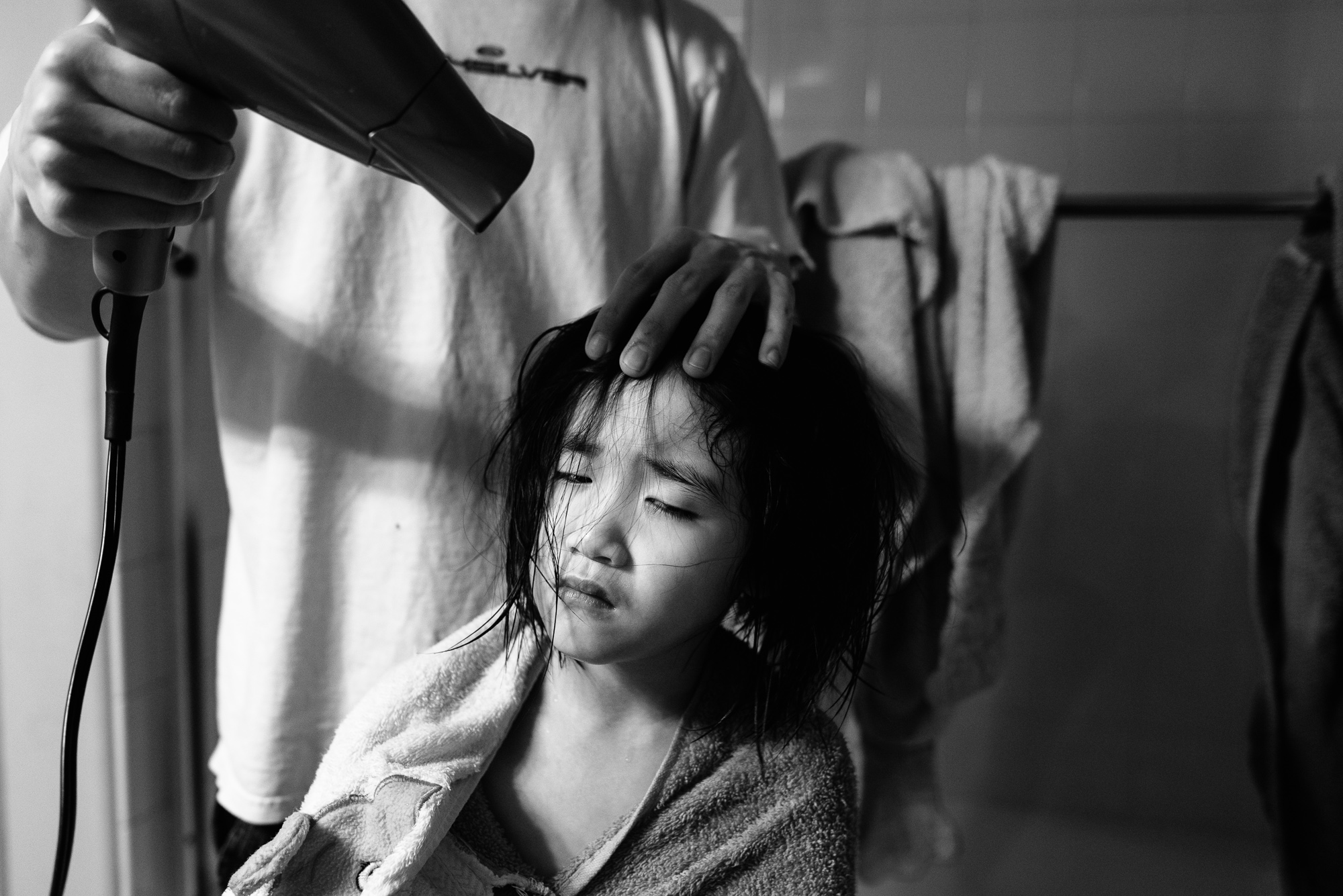 girl getting hair dried - Documentary Family Photography