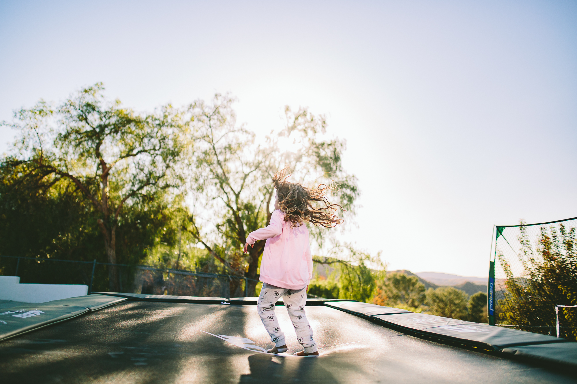 girl on trampoline - Documentary Family Photography