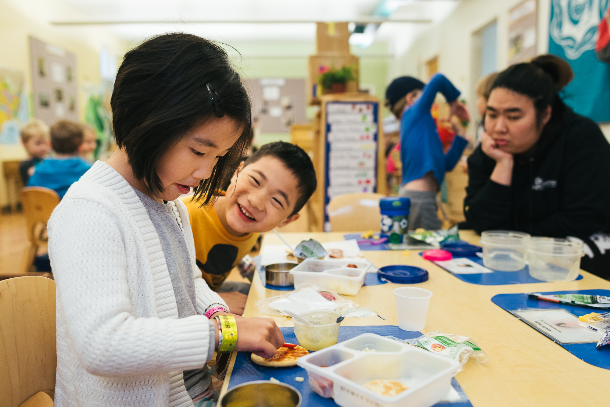 brother and sister eat lunch together at school - Documentary Family Photography