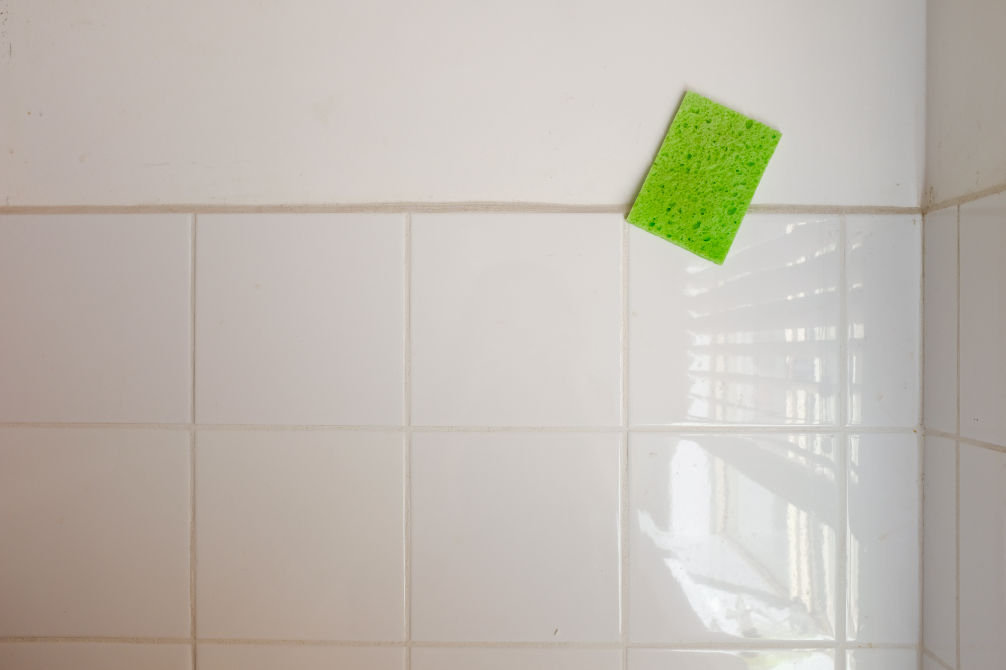 sponge stuck to wall - documentary family photography